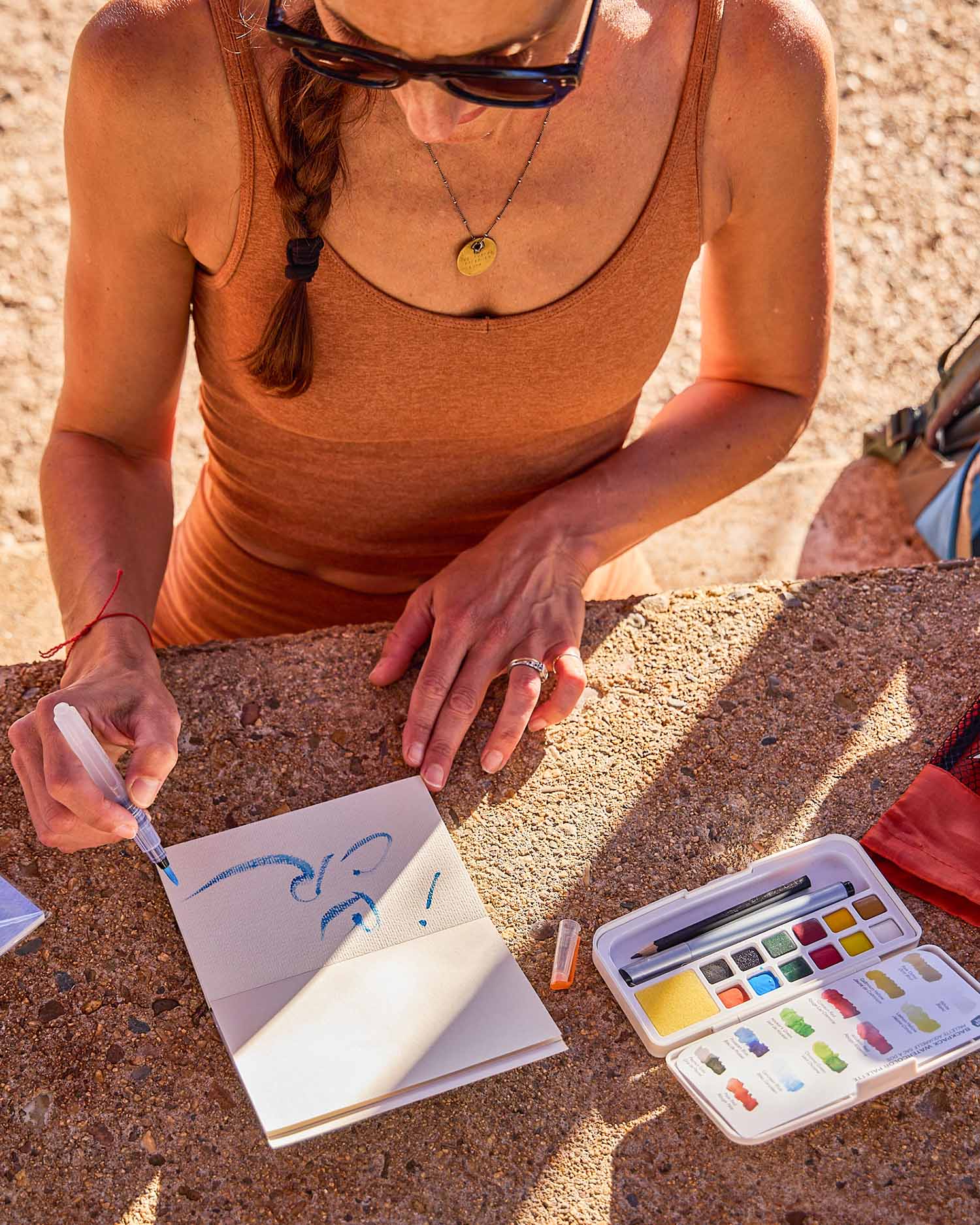 A woman painting outdoors