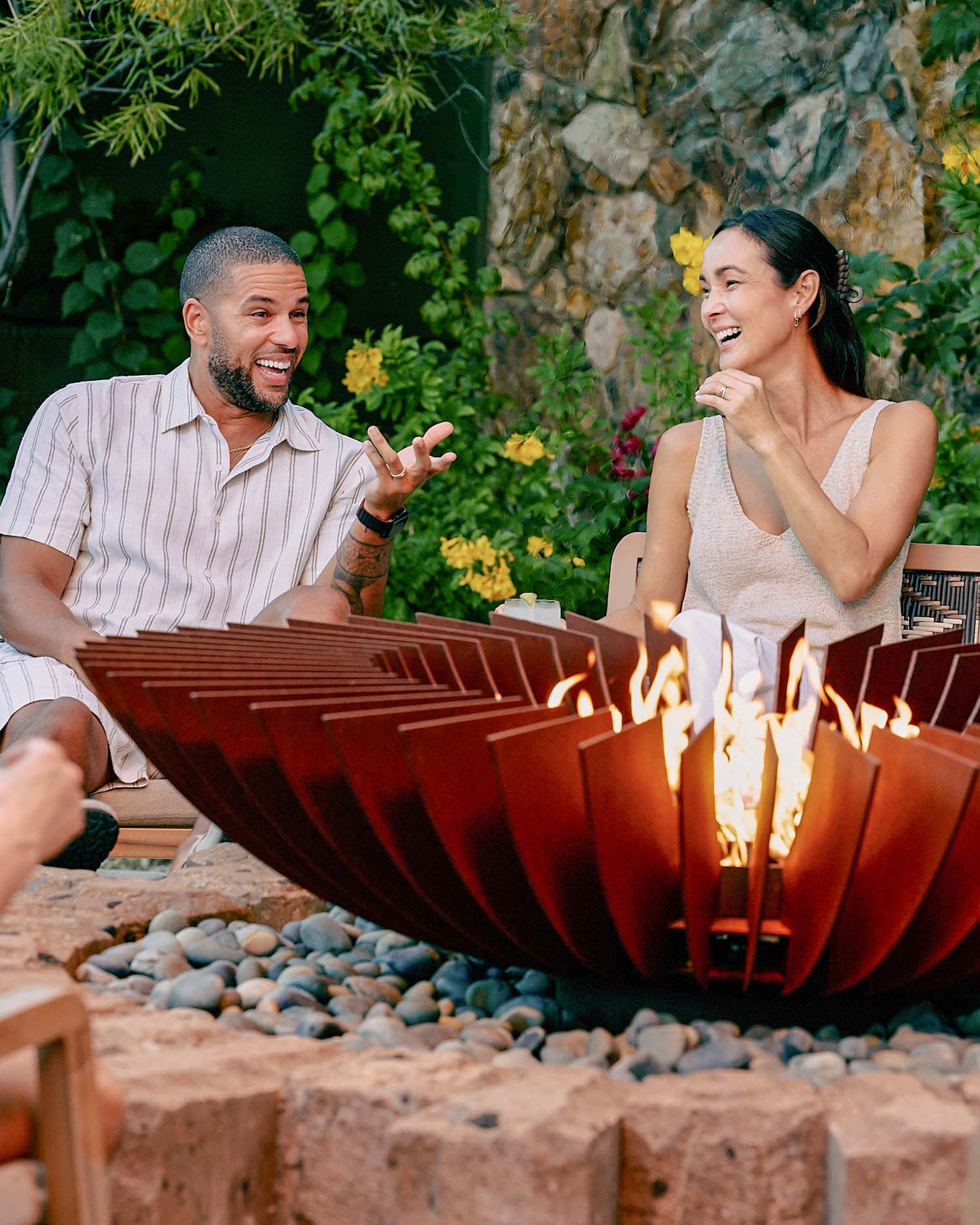 A couple by a campfire at Canyon Ranch