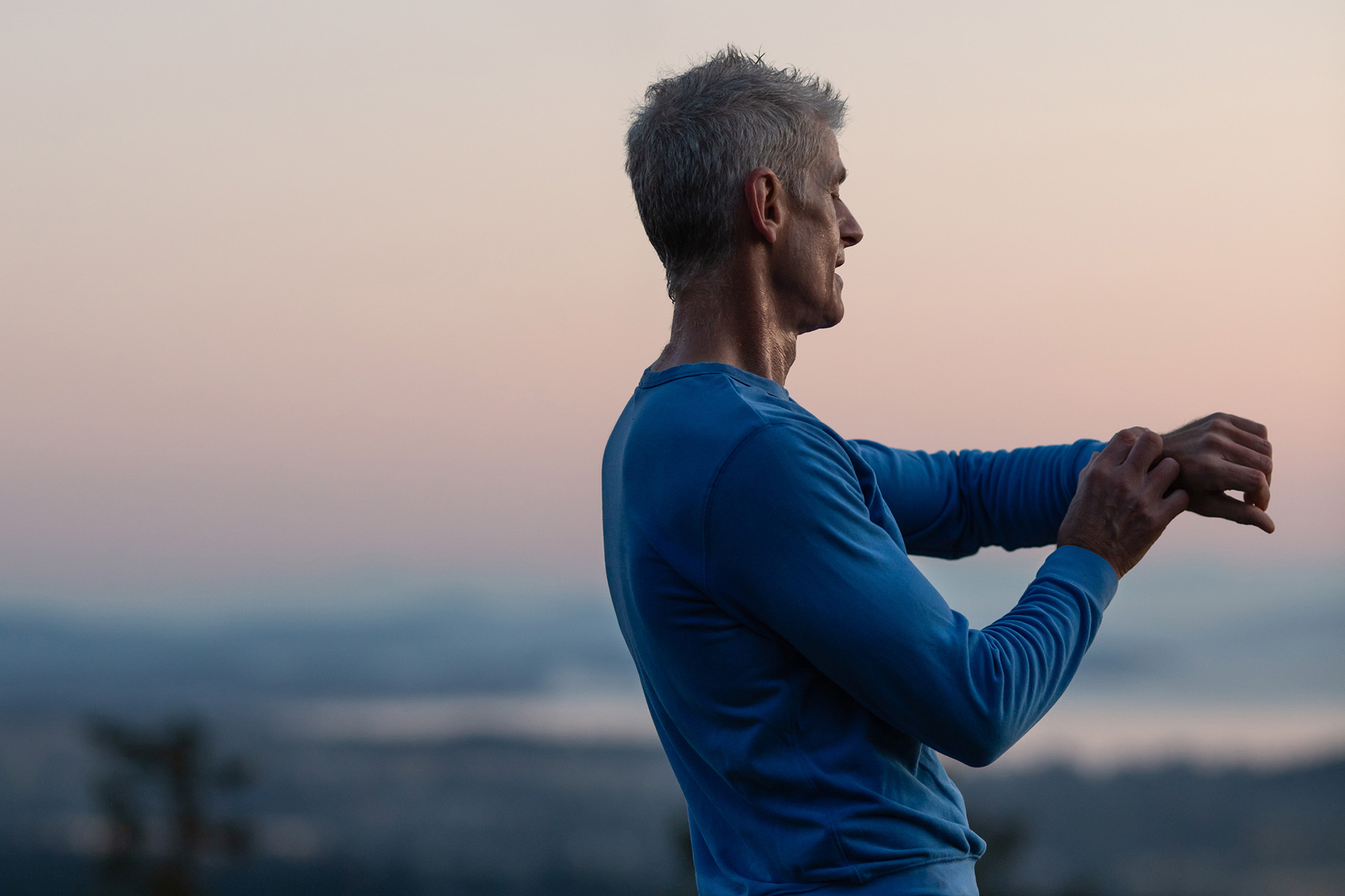 Man looking at his fitness tracker