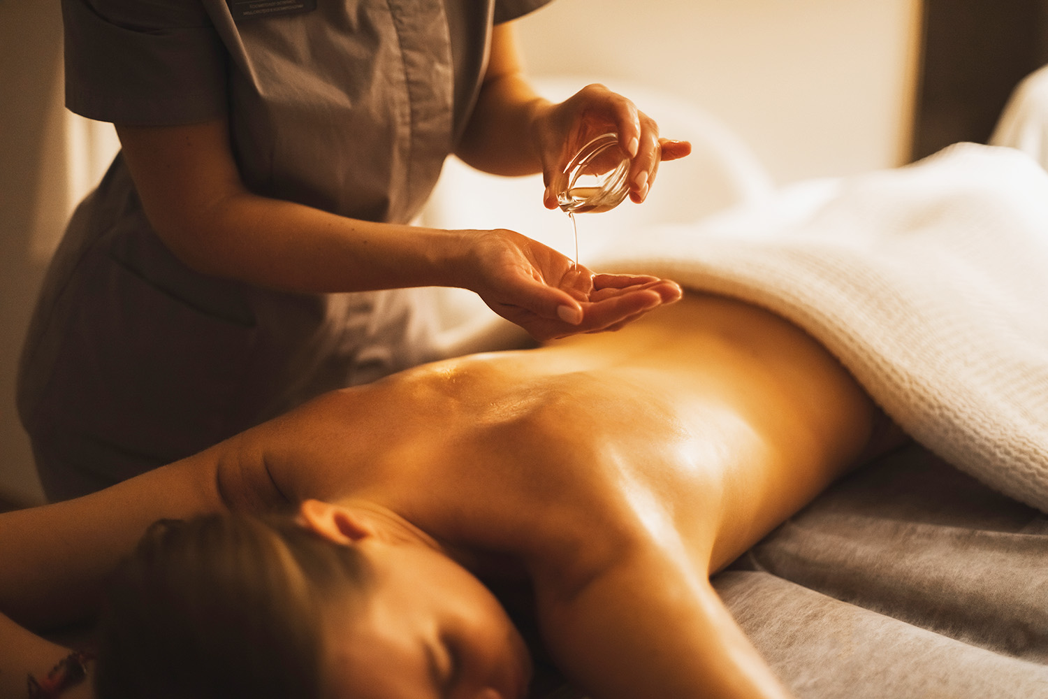 A woman getting a hot oil massage