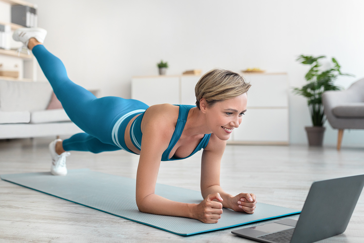 Woman Working Out Behind a Laptop