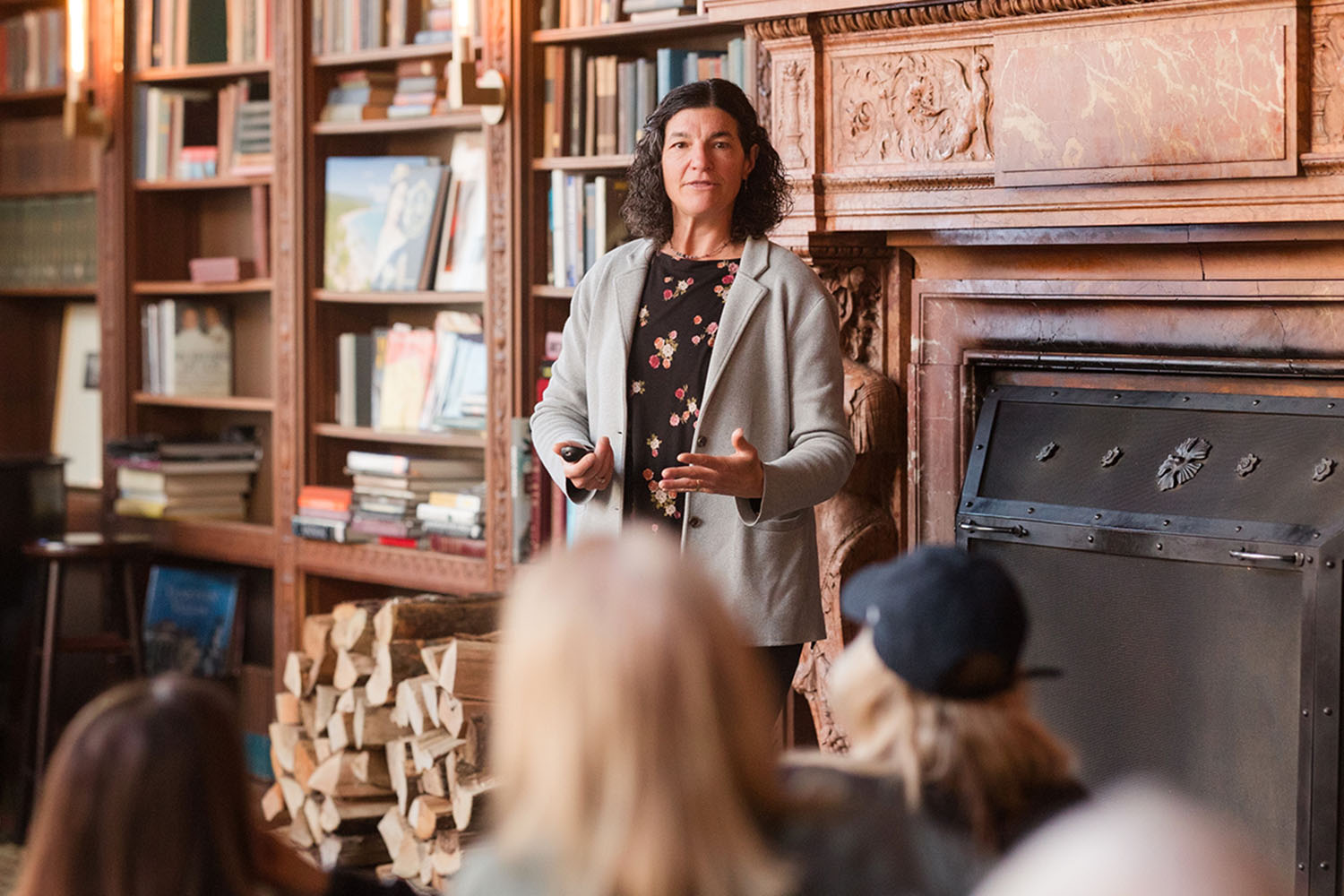 a woman giving a lecture at Canyon Ranch Lenox in the Mansion Library