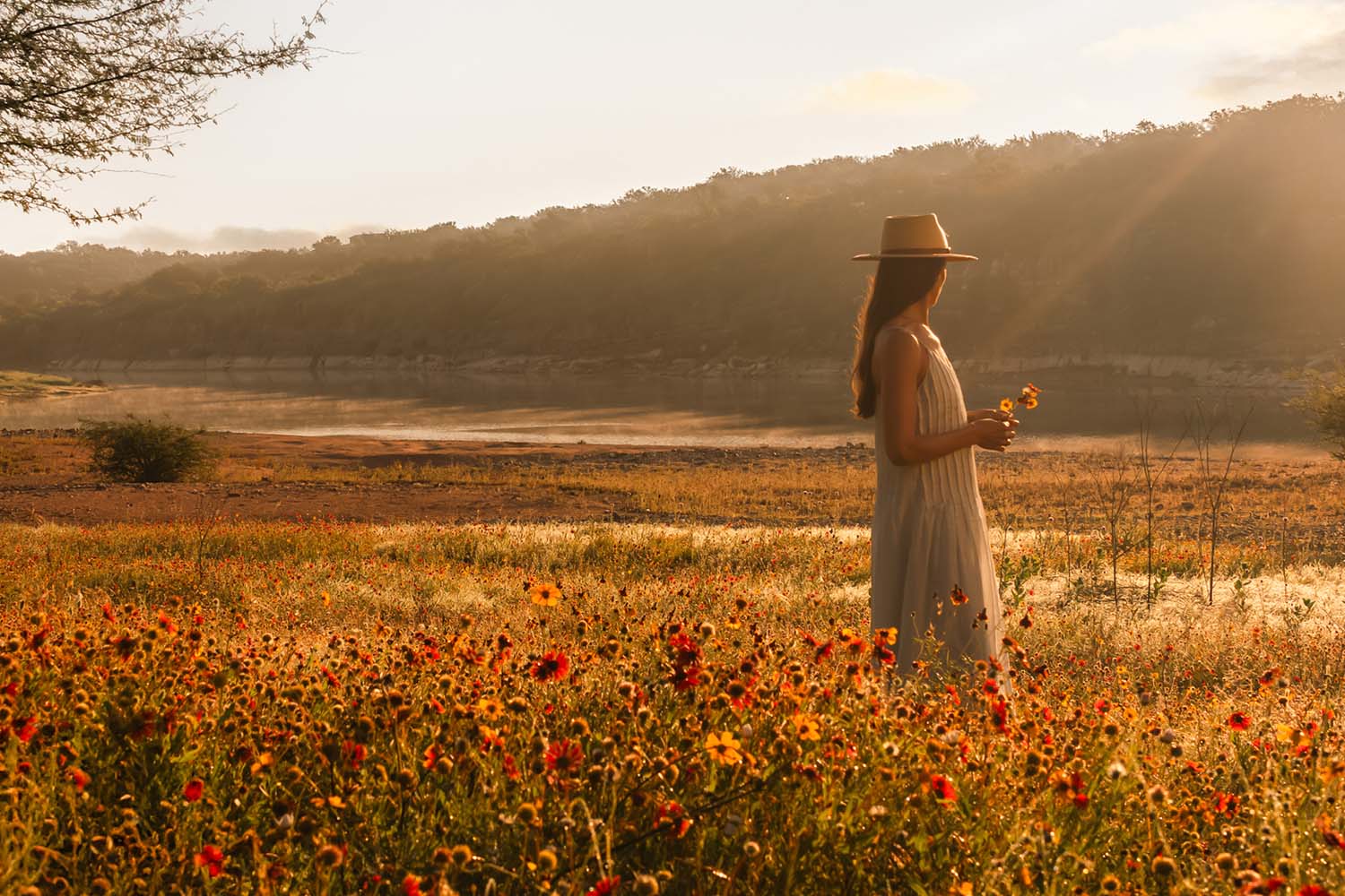 a woman in a field of Texas wildflowers