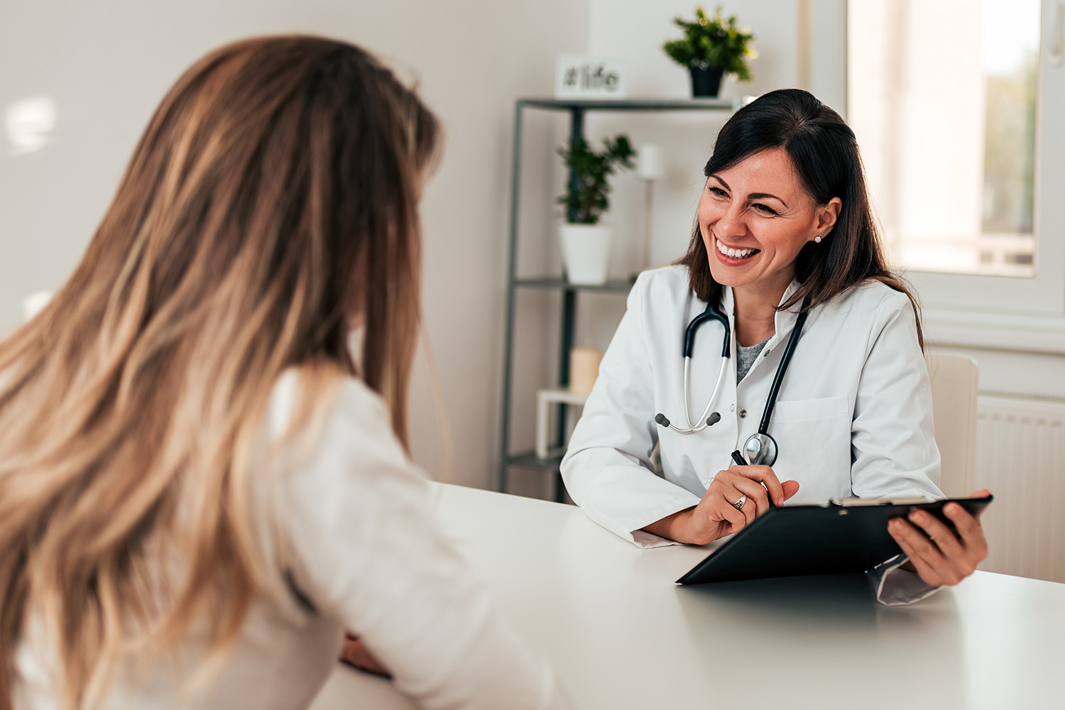 a woman talking with her doctor