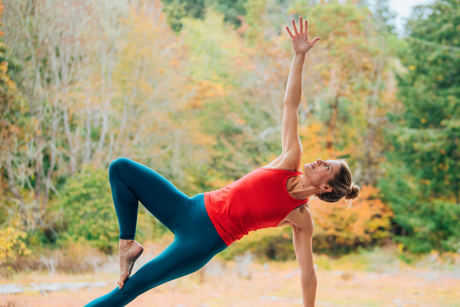 Woman Practicing Yoga Outdoors in the Fall 