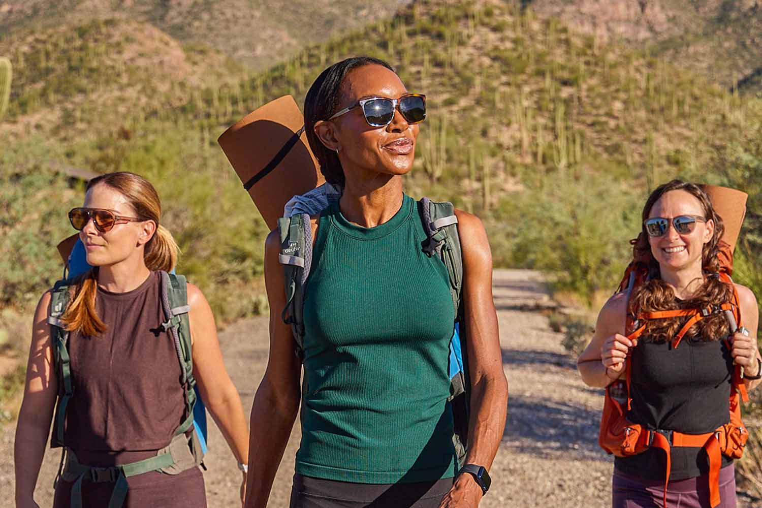 Three women hiking in the desert
