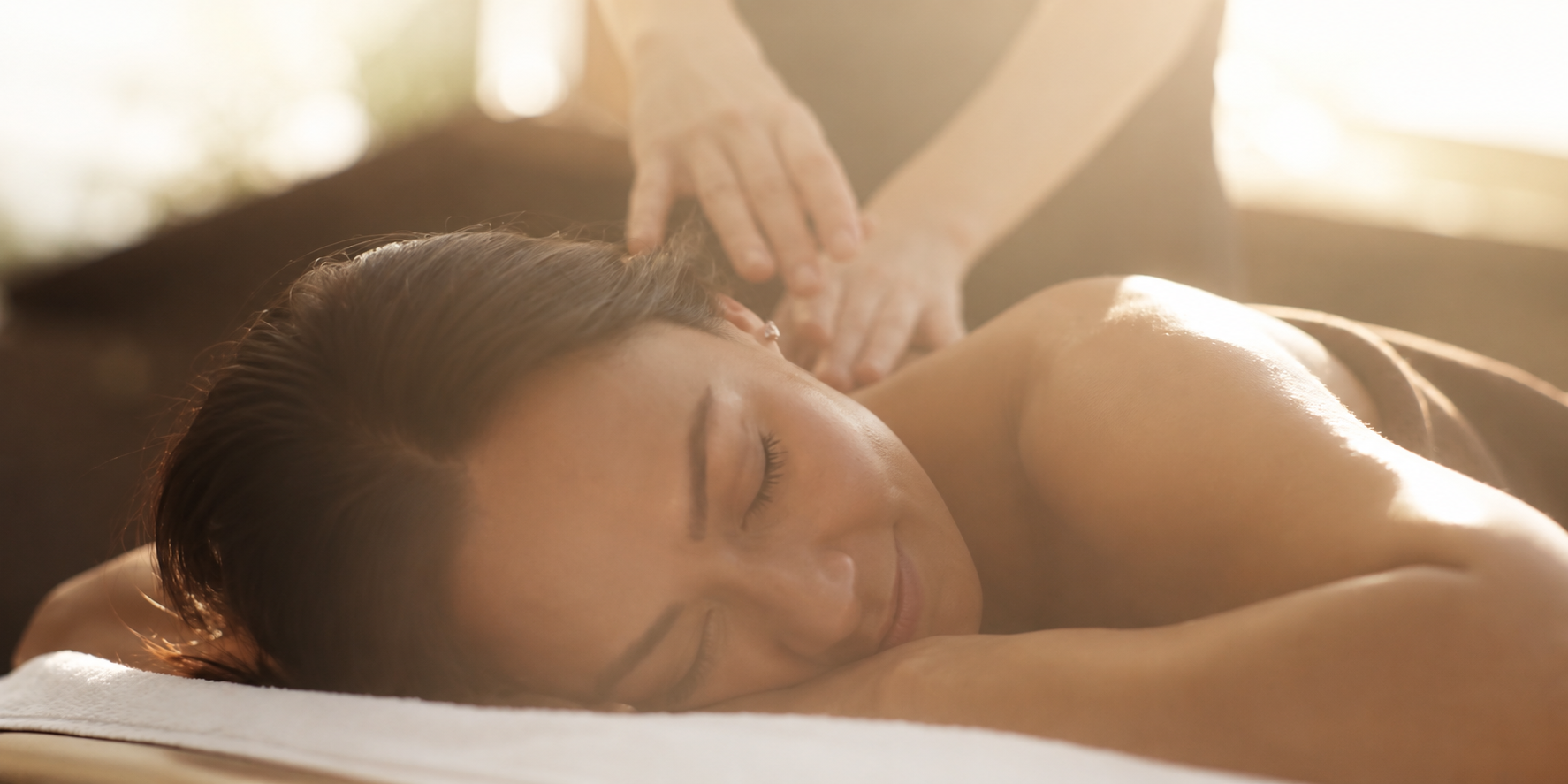 A close up of a woman getting a massage