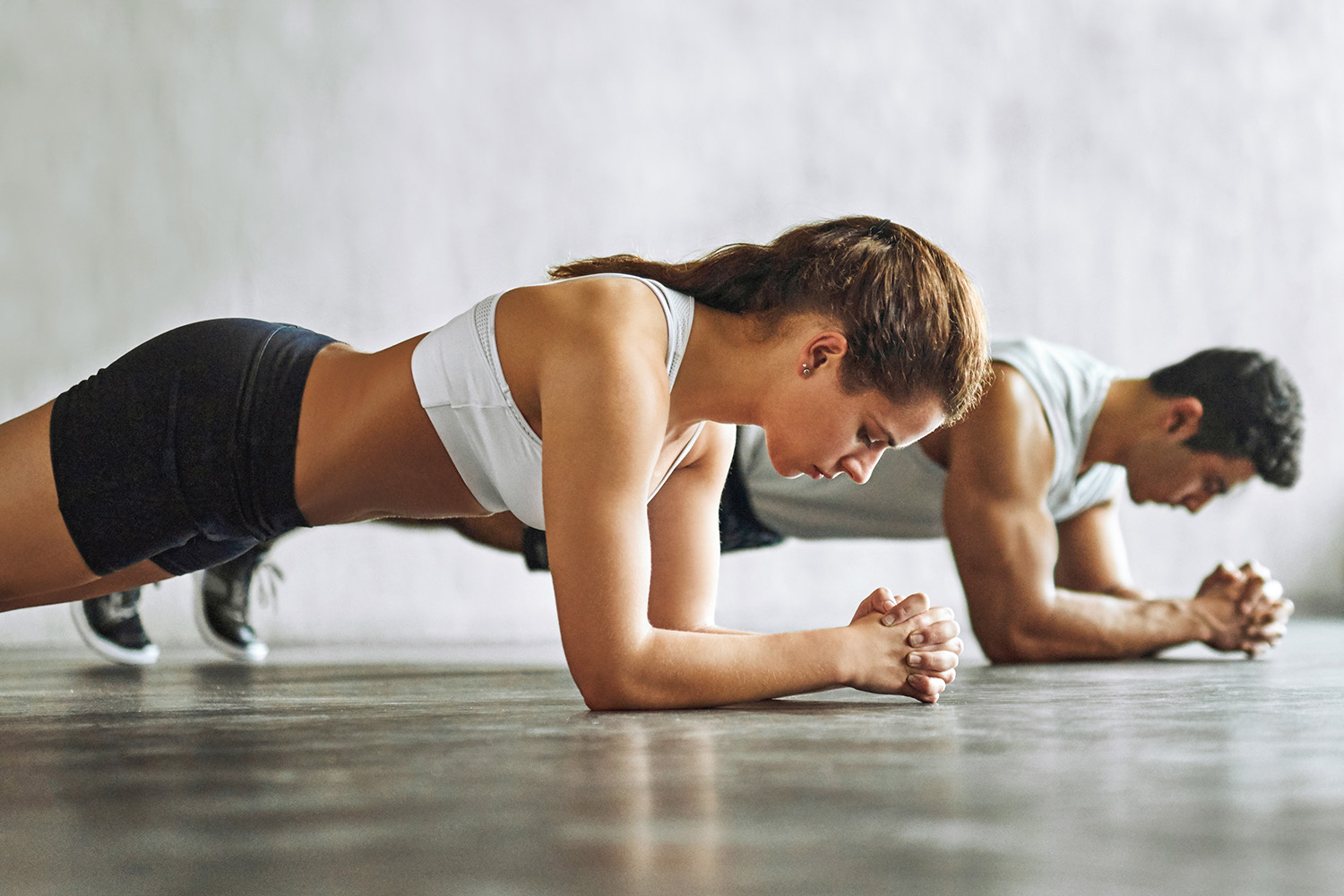 Man and Woman Planking 