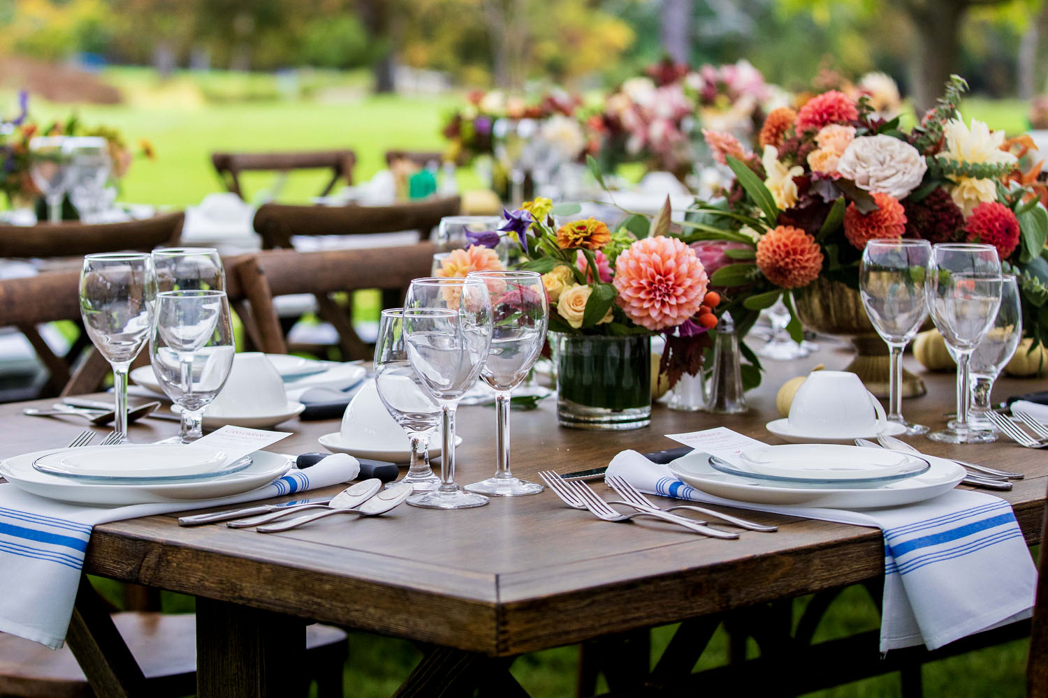 A large table set and decorated on the Great Lawn at Canyon Ranch Lenox