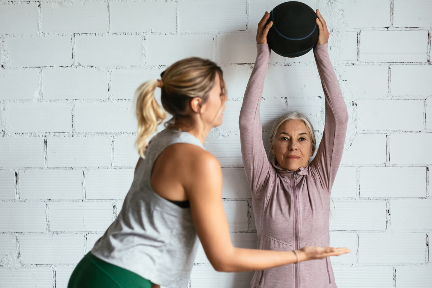 Woman Holding a Medicine Ball During Personal Training
