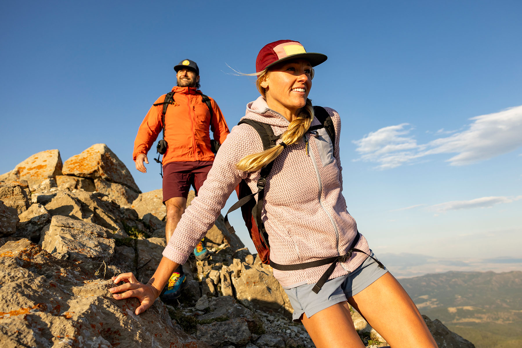 Man and Woman Hiking on Top of a Mountain 
