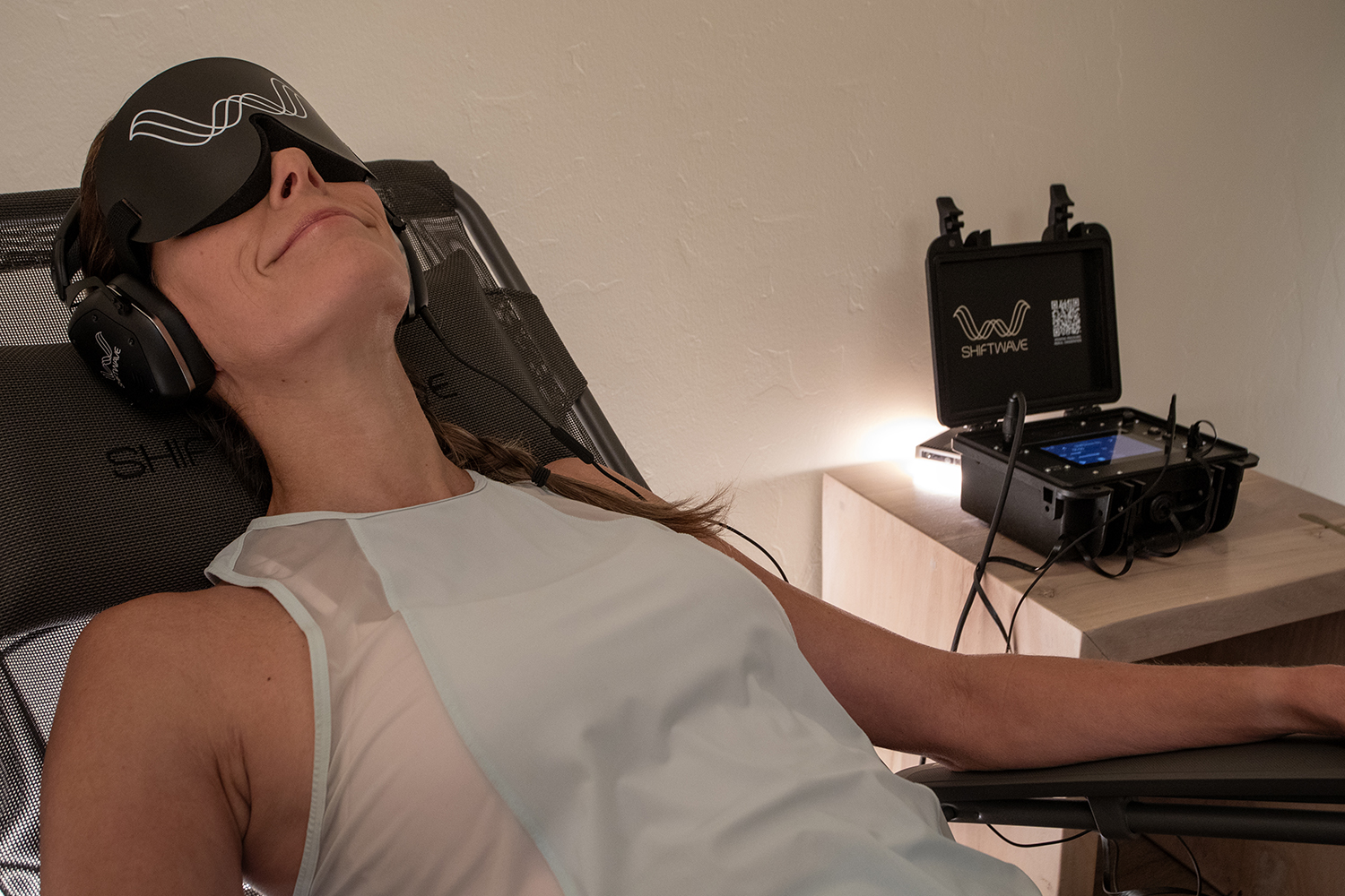Woman With Eye Mask During  Shiftwave® Nervous System Training Technology Session