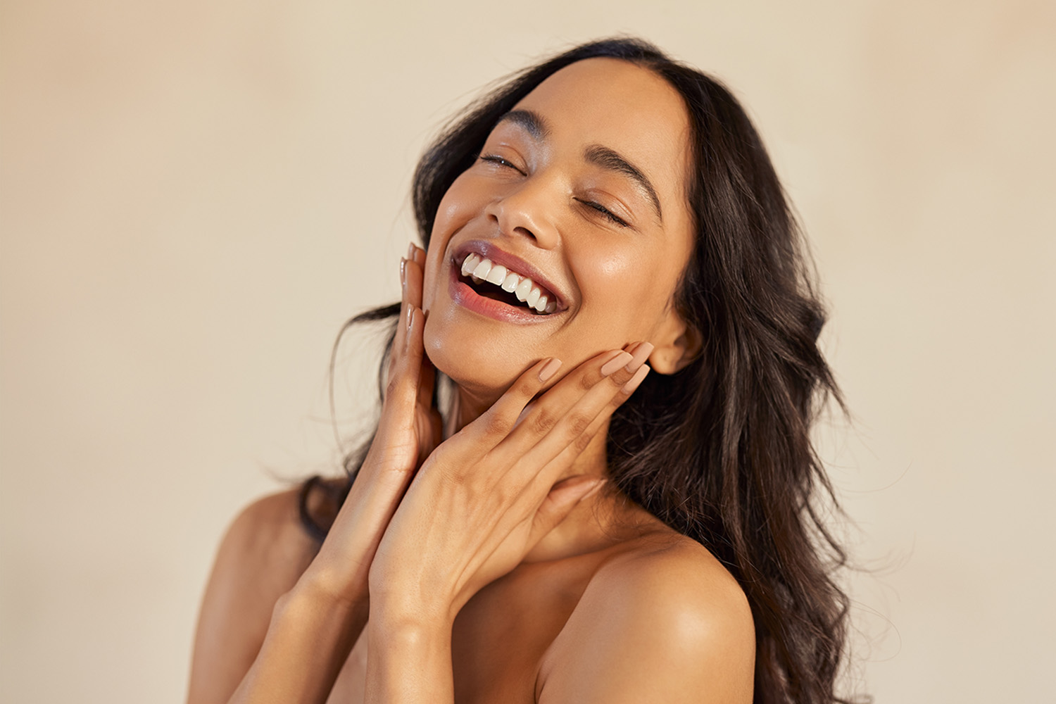 A Woman Smiling With Healthy Skin