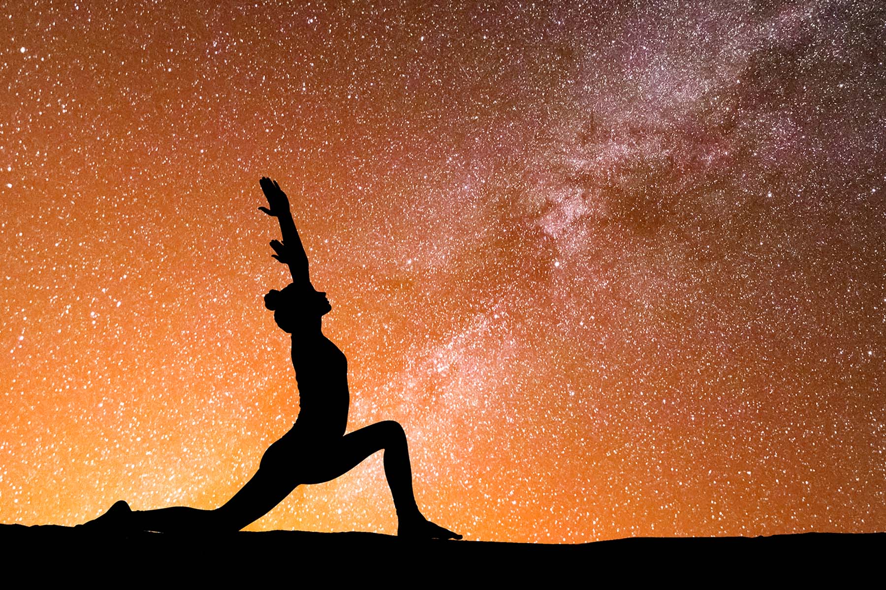 Woman Practicing Yoga Under The Stars