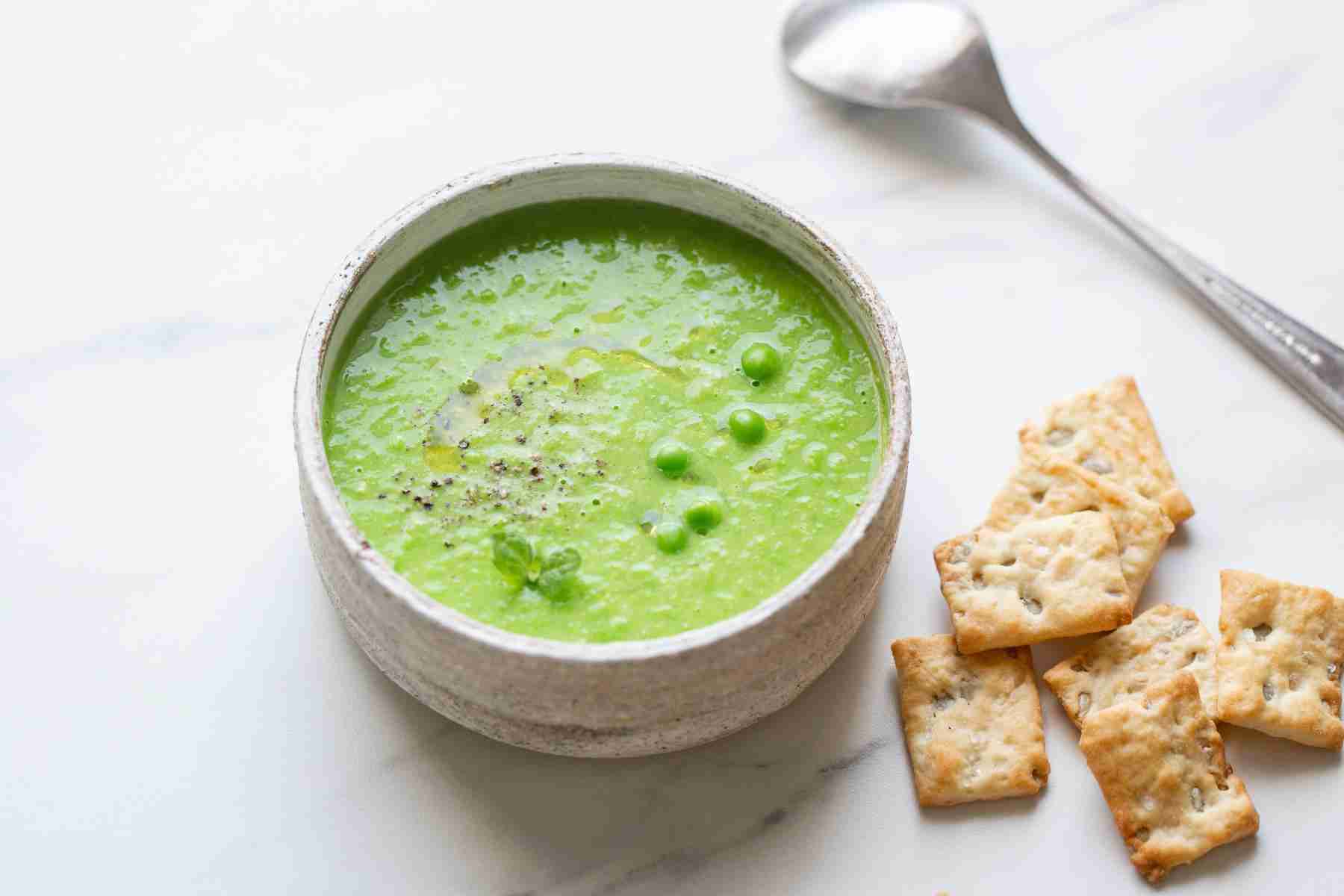 Overhead view of a bowl of spring pea soup.