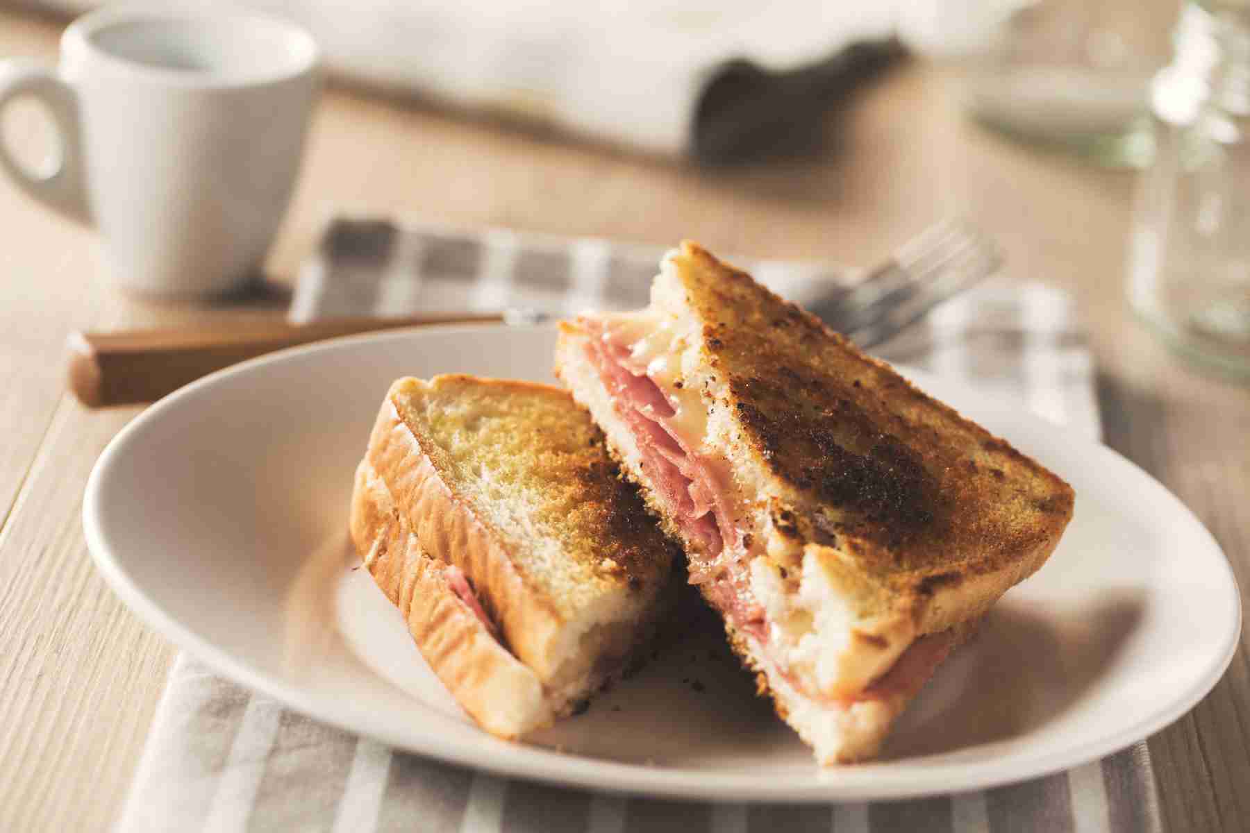 Turkey reuben sandwich cut diagonally.