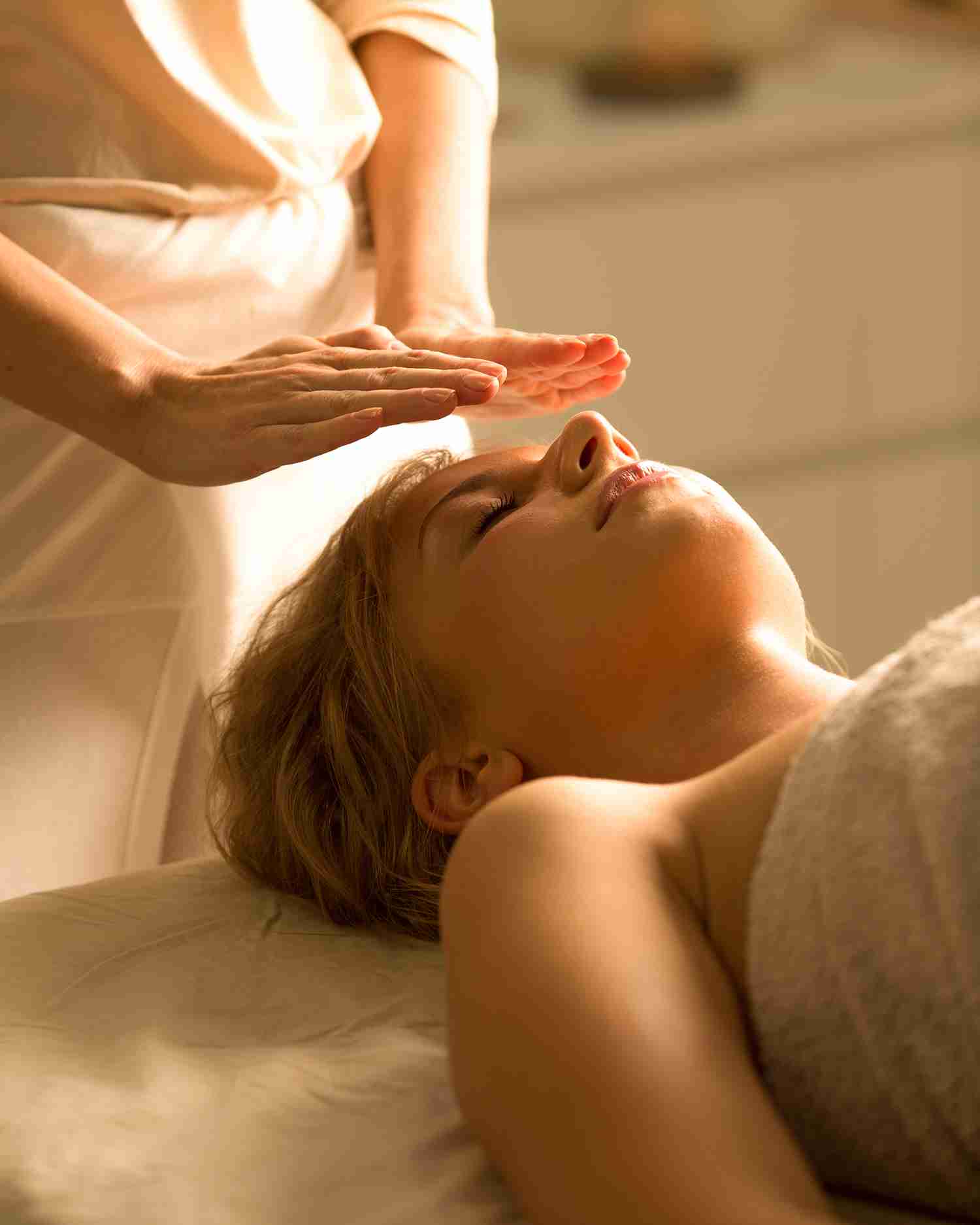 A woman getting a reiki healing