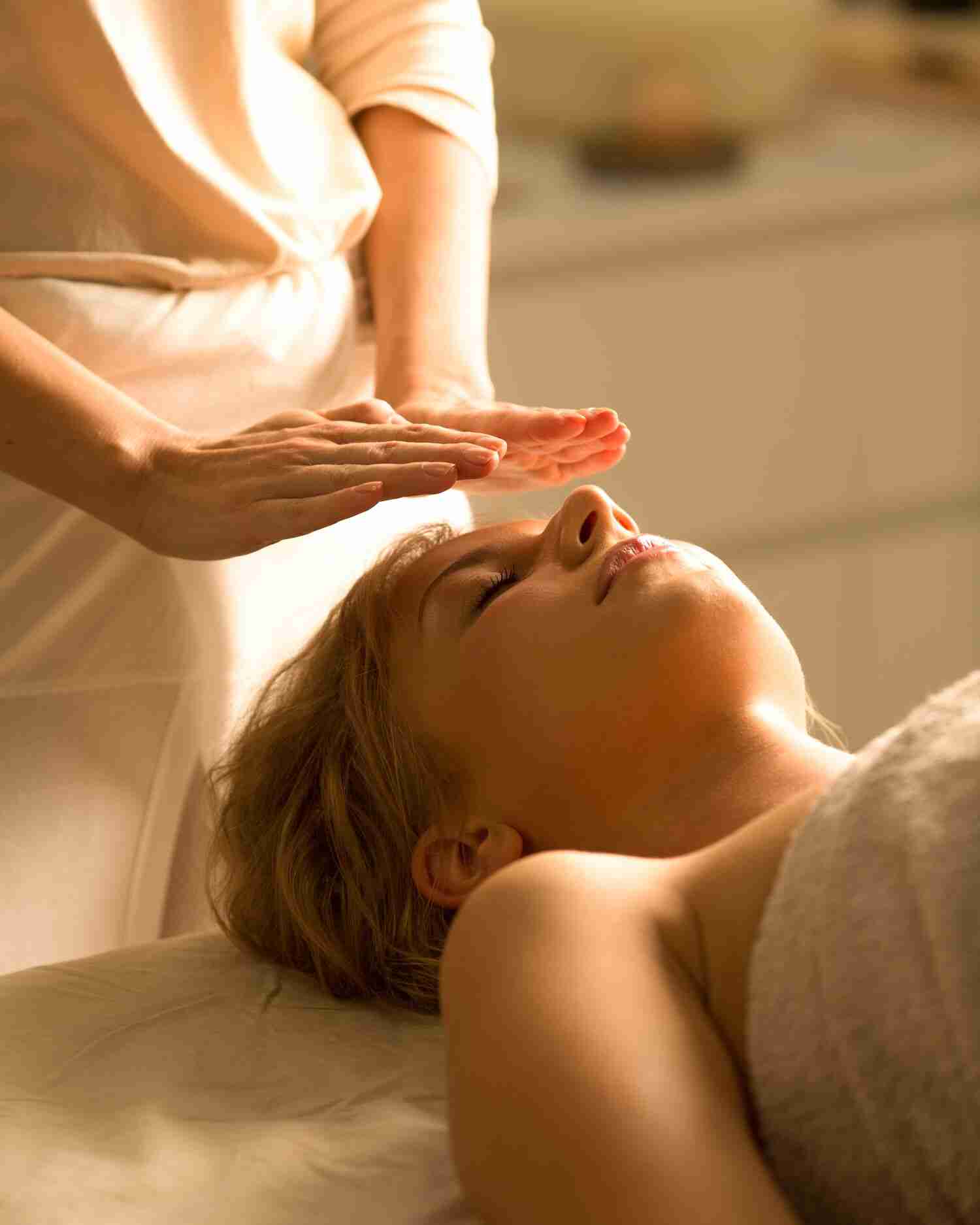 A woman getting a reiki healing