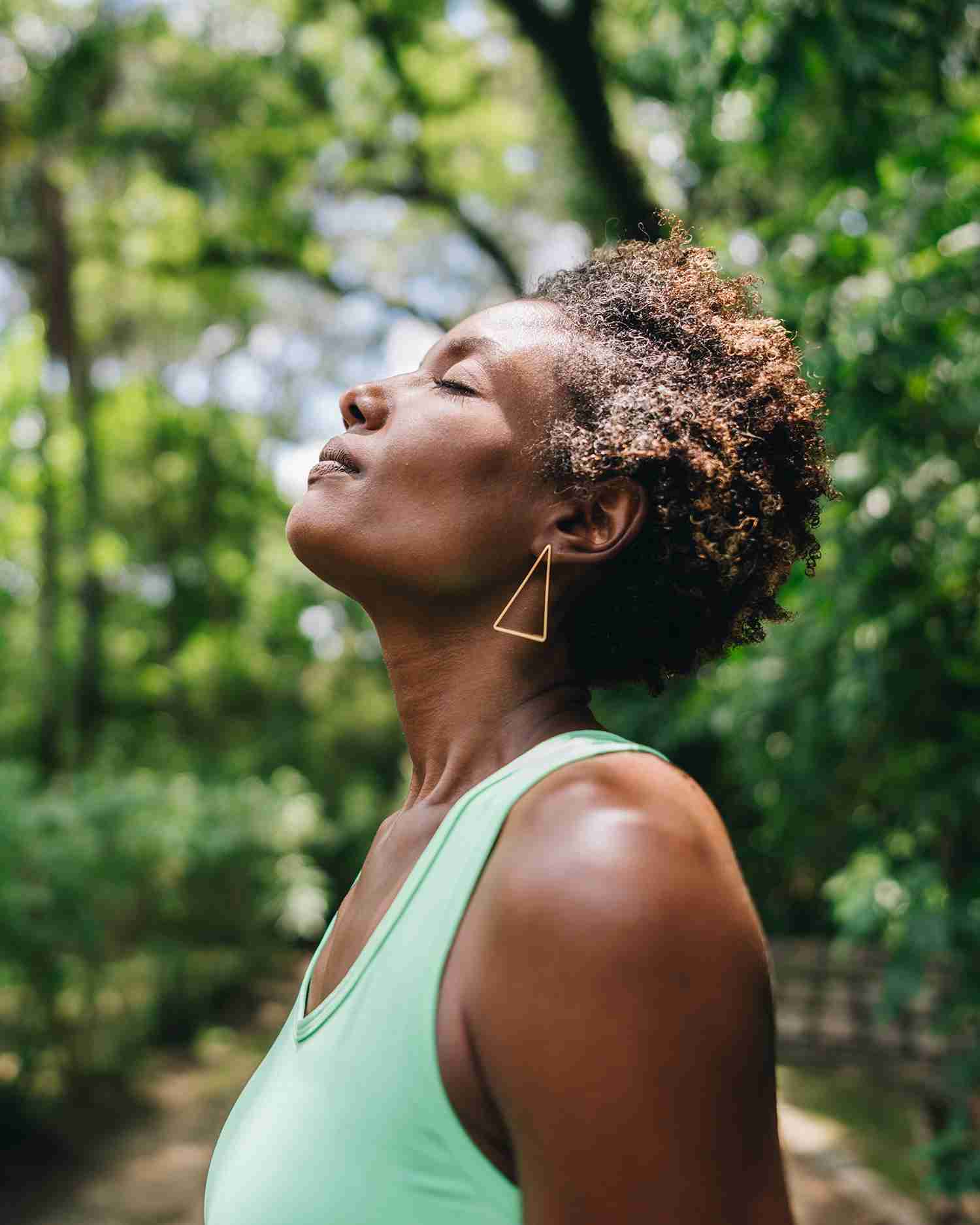 a woman meditating in the berkshire forest