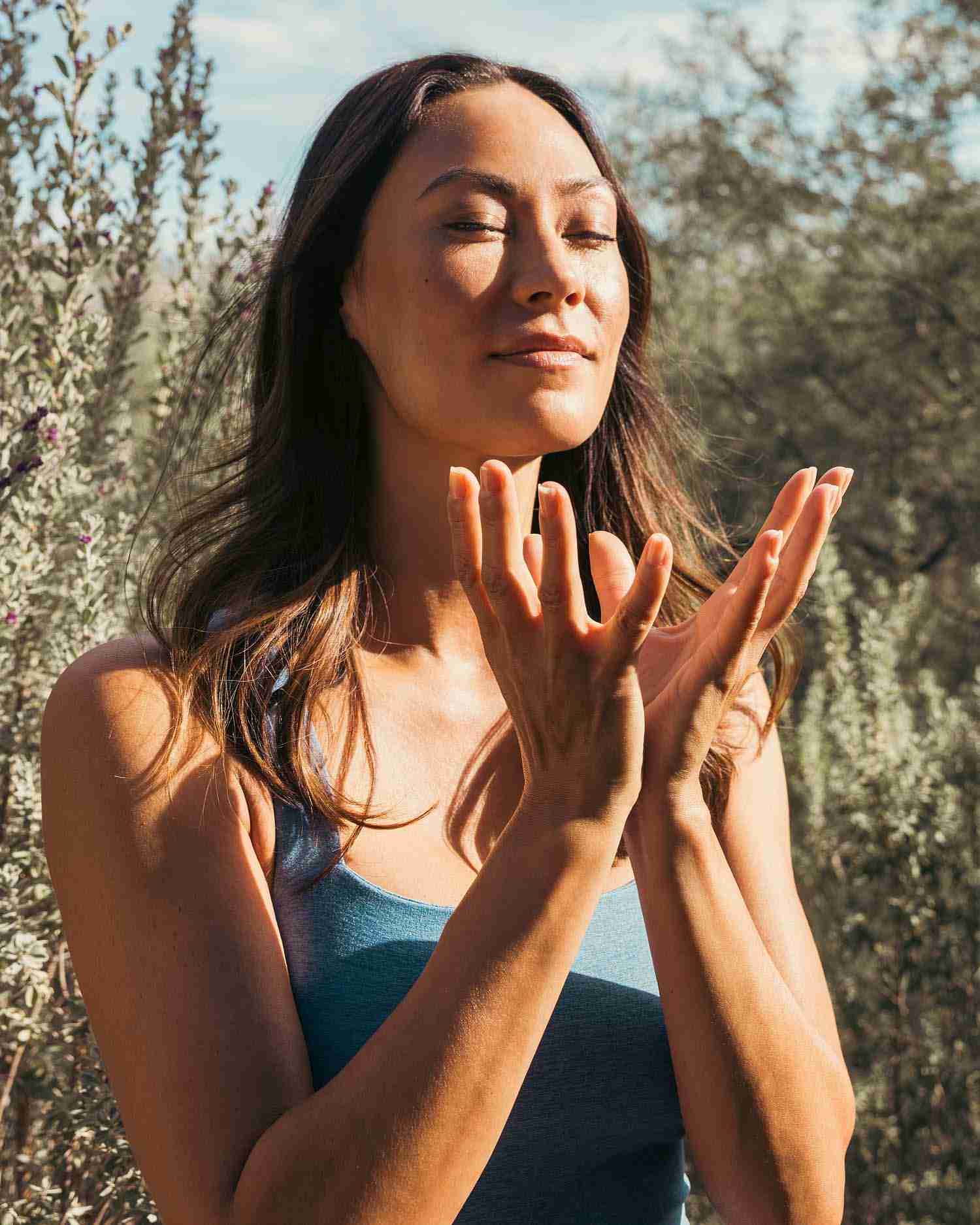 A woman meditating in the desert