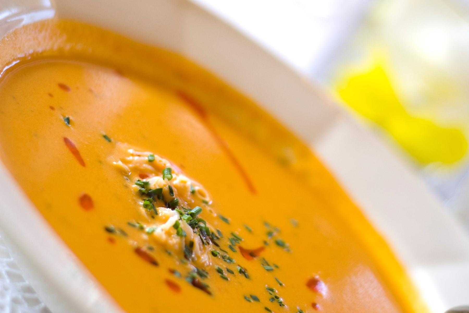 Close-up of roasted red pepper and tomato bisque.