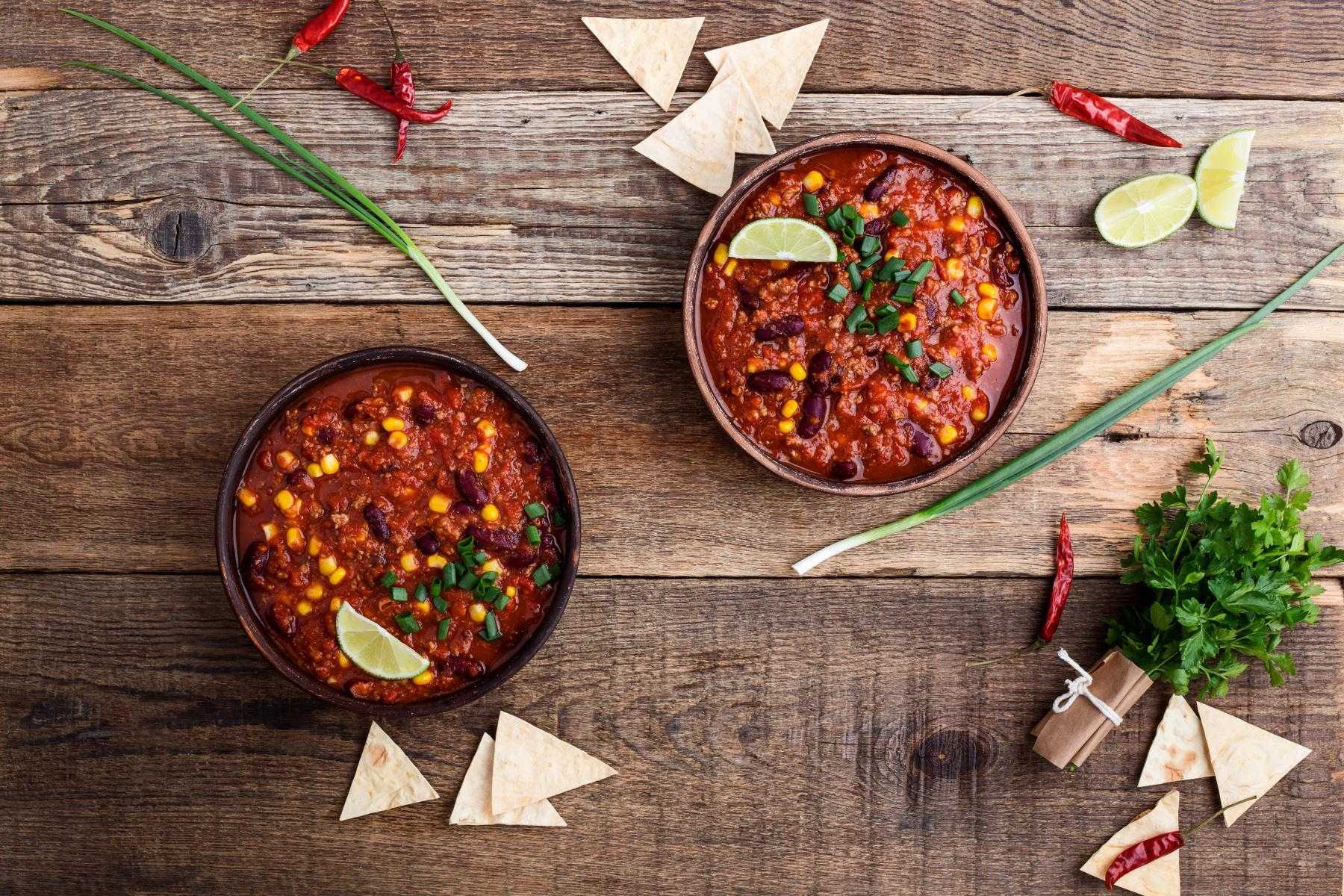 Overhead view of two bowls of chili.