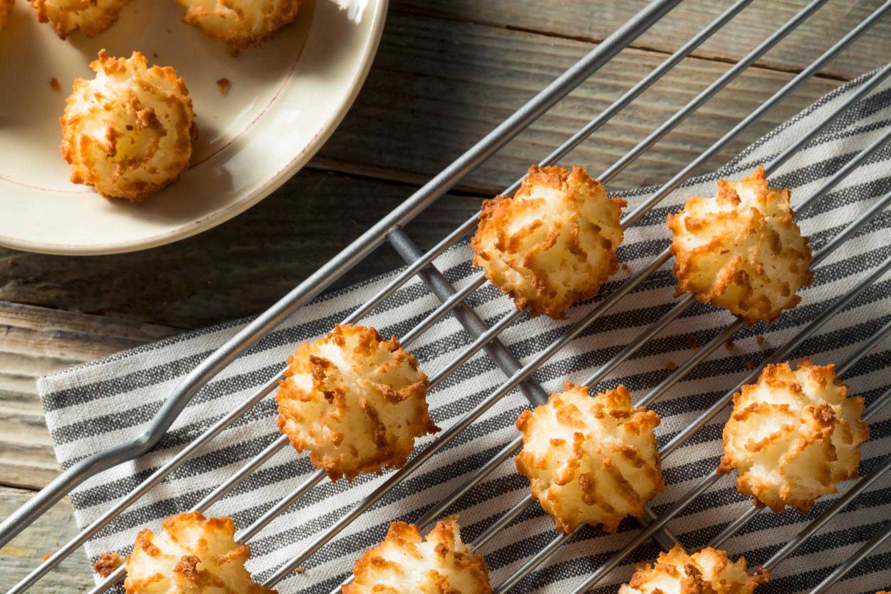 Overhead view of almond macaroons on a cooling rack.