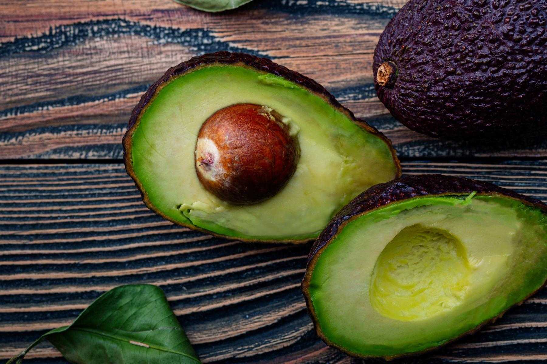 Overhead view of avocado cut in half.