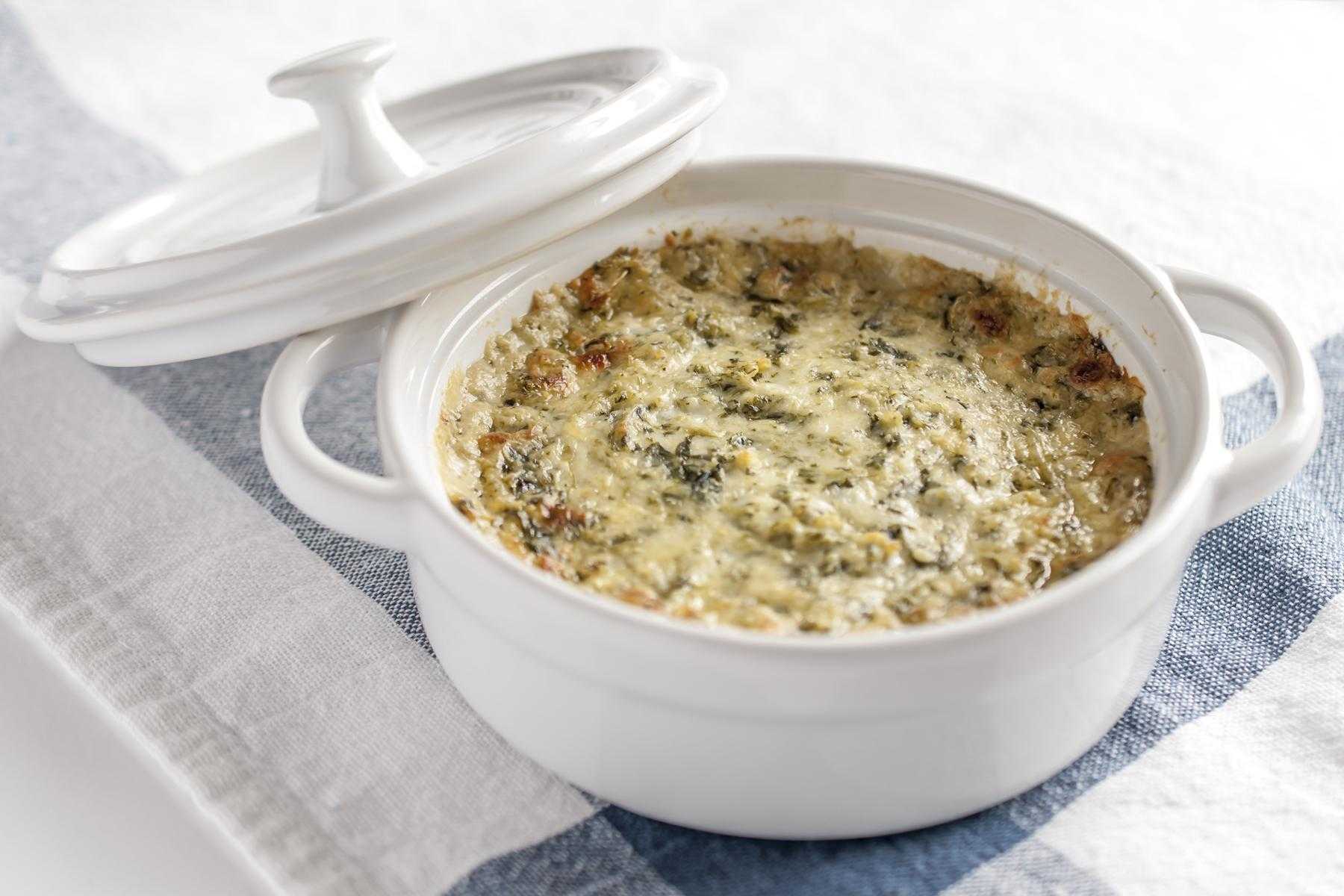 Artichoke Dip in a white dish.