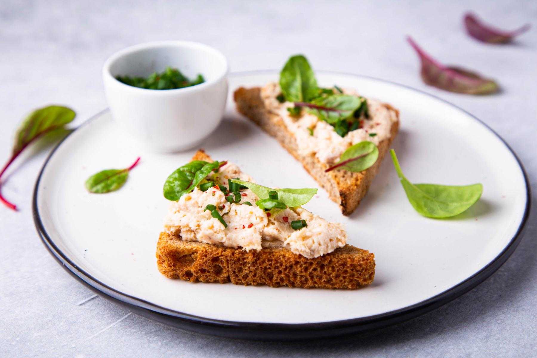 Open tuna sandwich on rye bread.