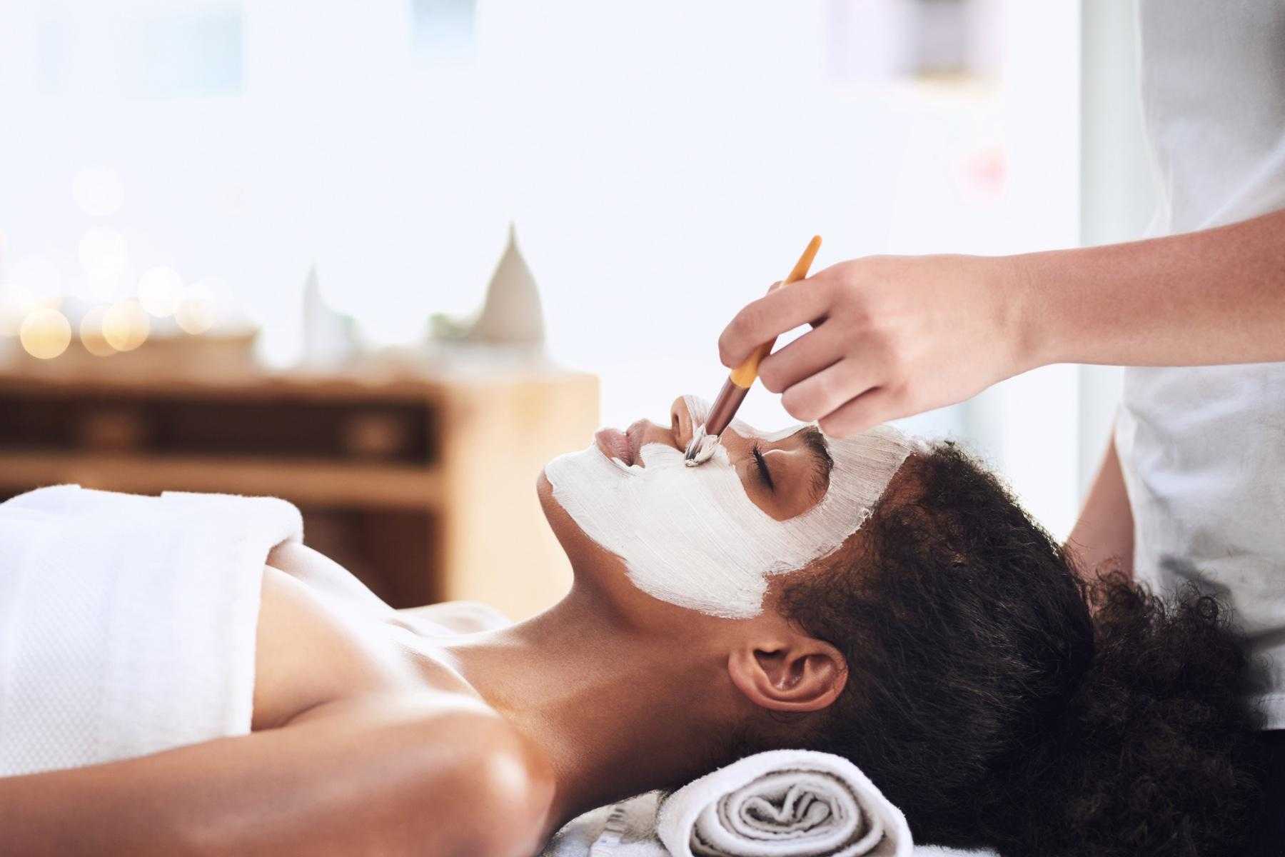 Woman receiving a facial.