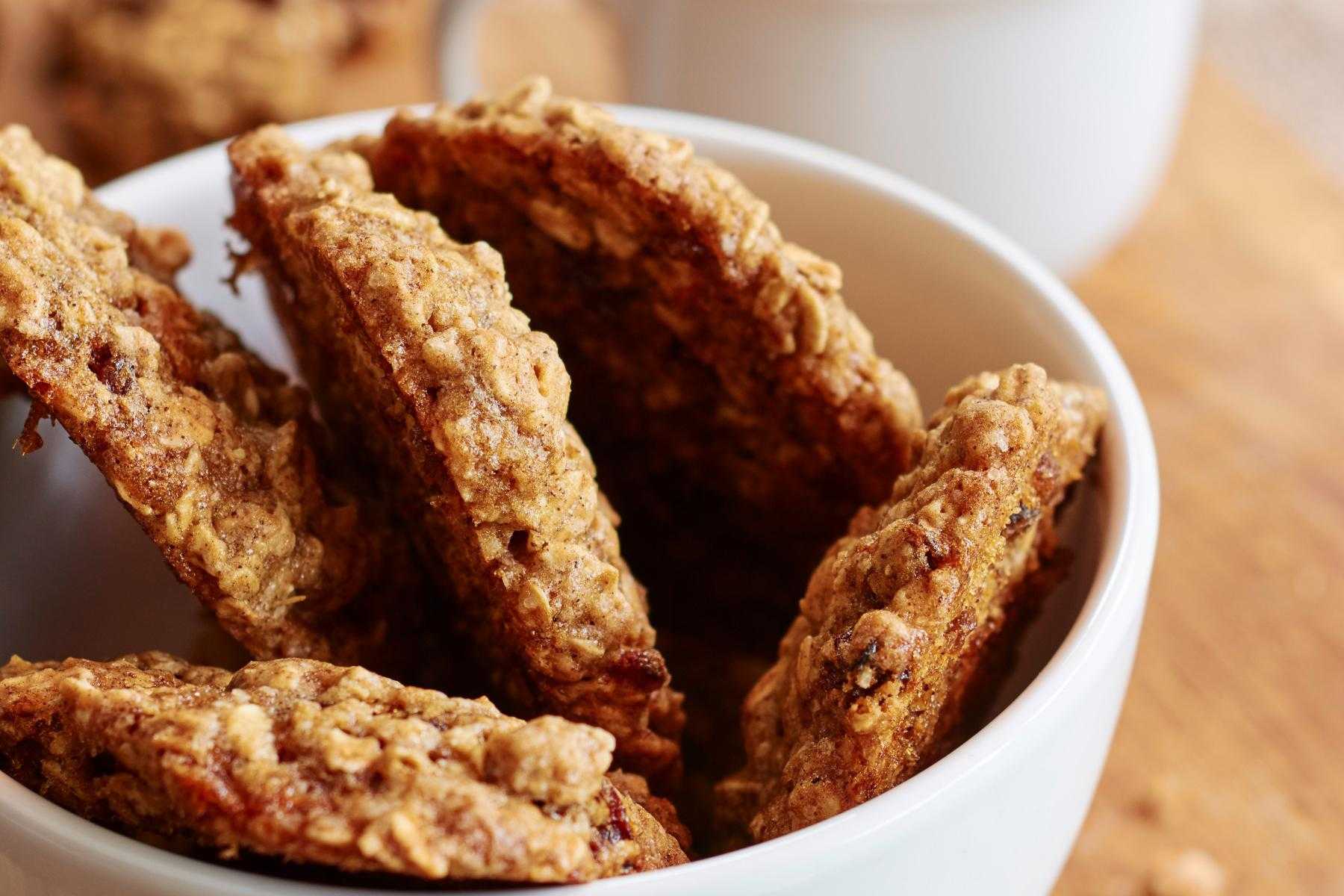 A bowl of 5 oatmeal cookies.