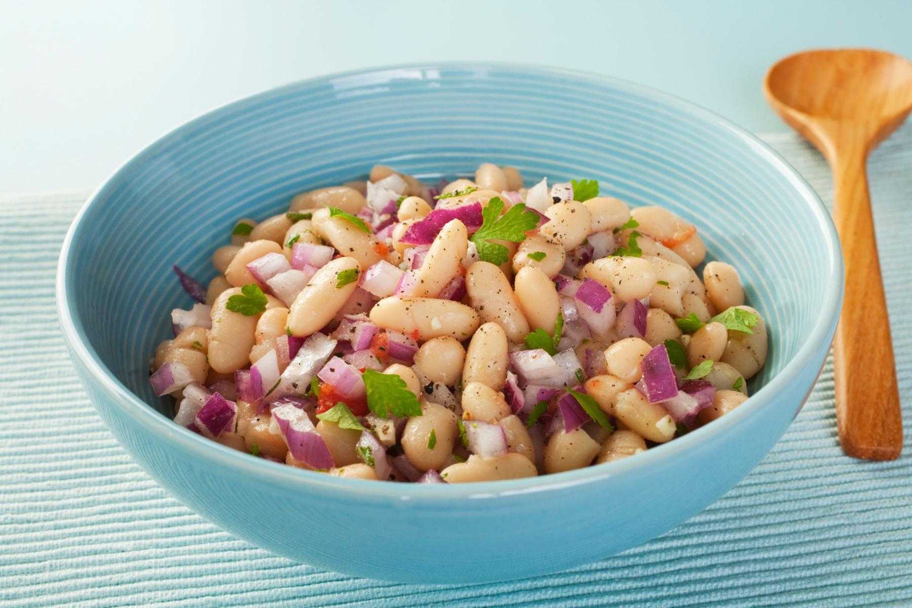 Blue bowl of bean salad.