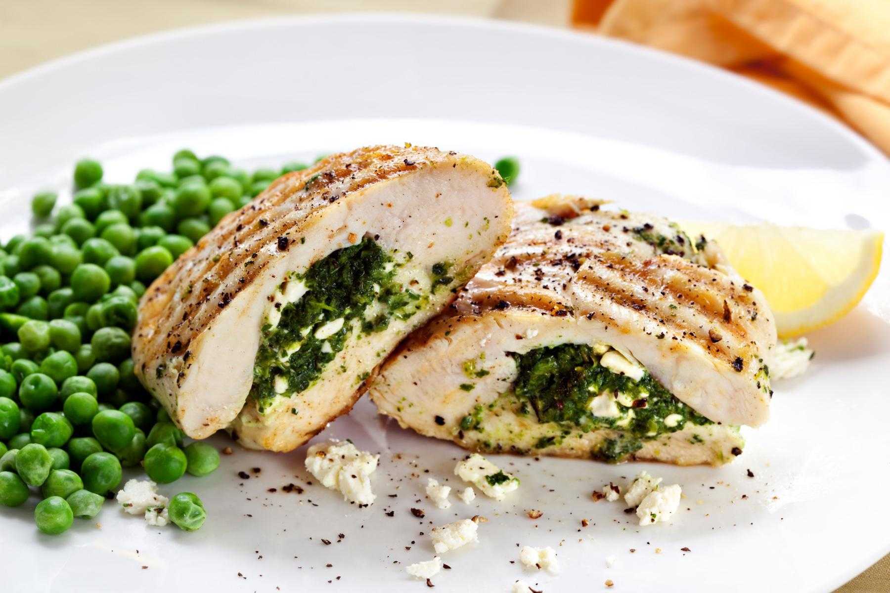 Plate of chicken stuffed with spinach and feta.