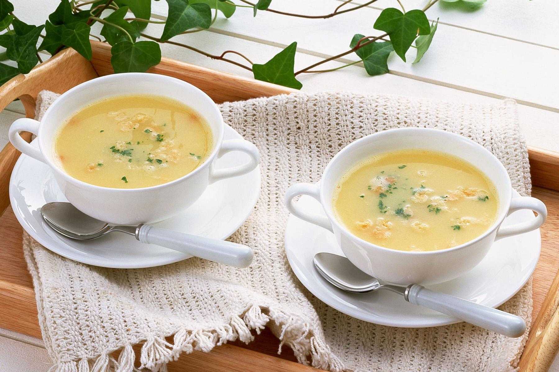 Image of two bowls of cream of onion soup