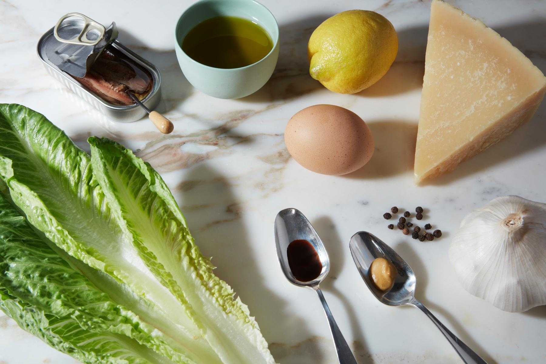 Overhead view of ingredients for Caesar salad.