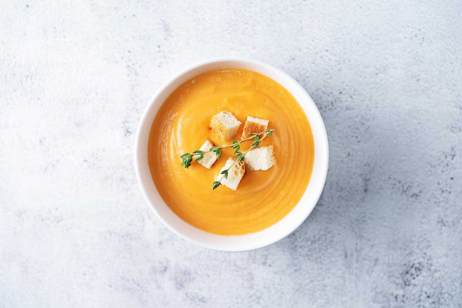 Overhead view of a bowl of sweet potato soup.