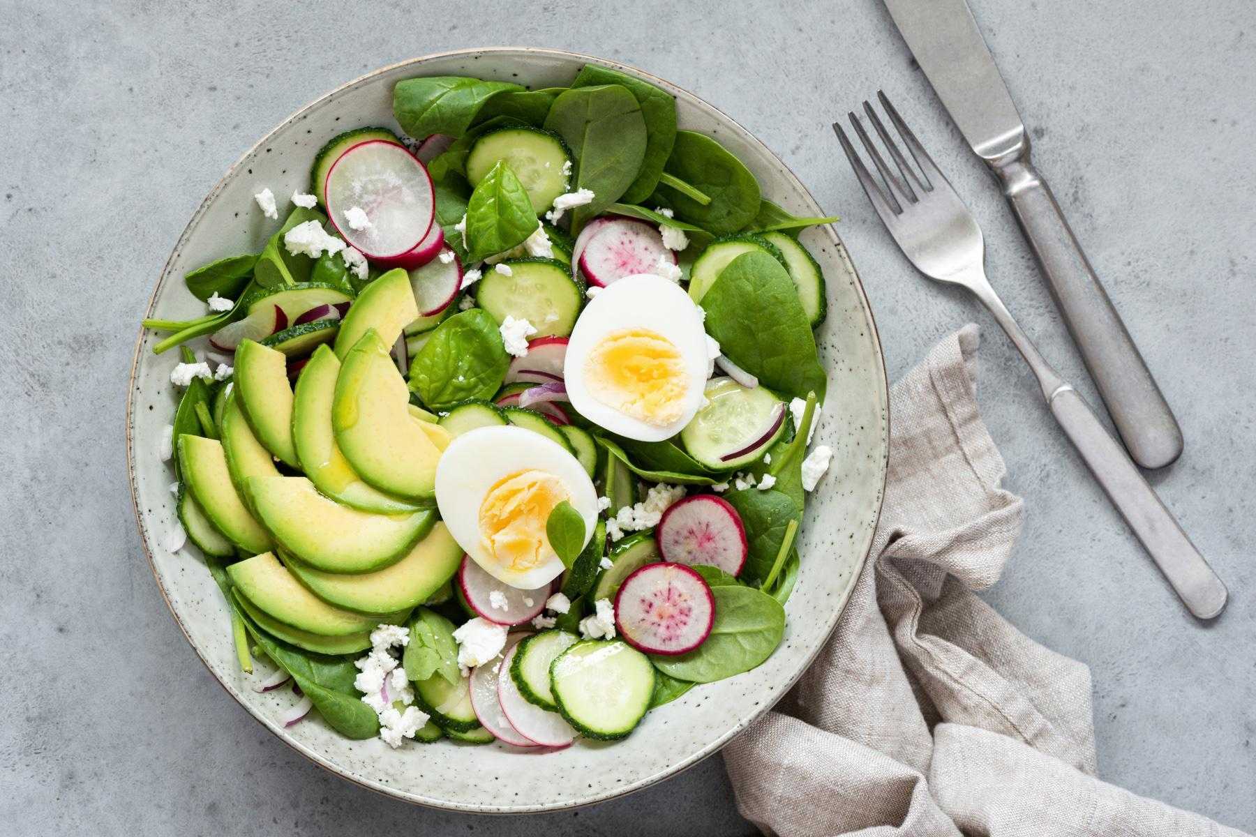 Overhead view of Cobb salad in bowl.