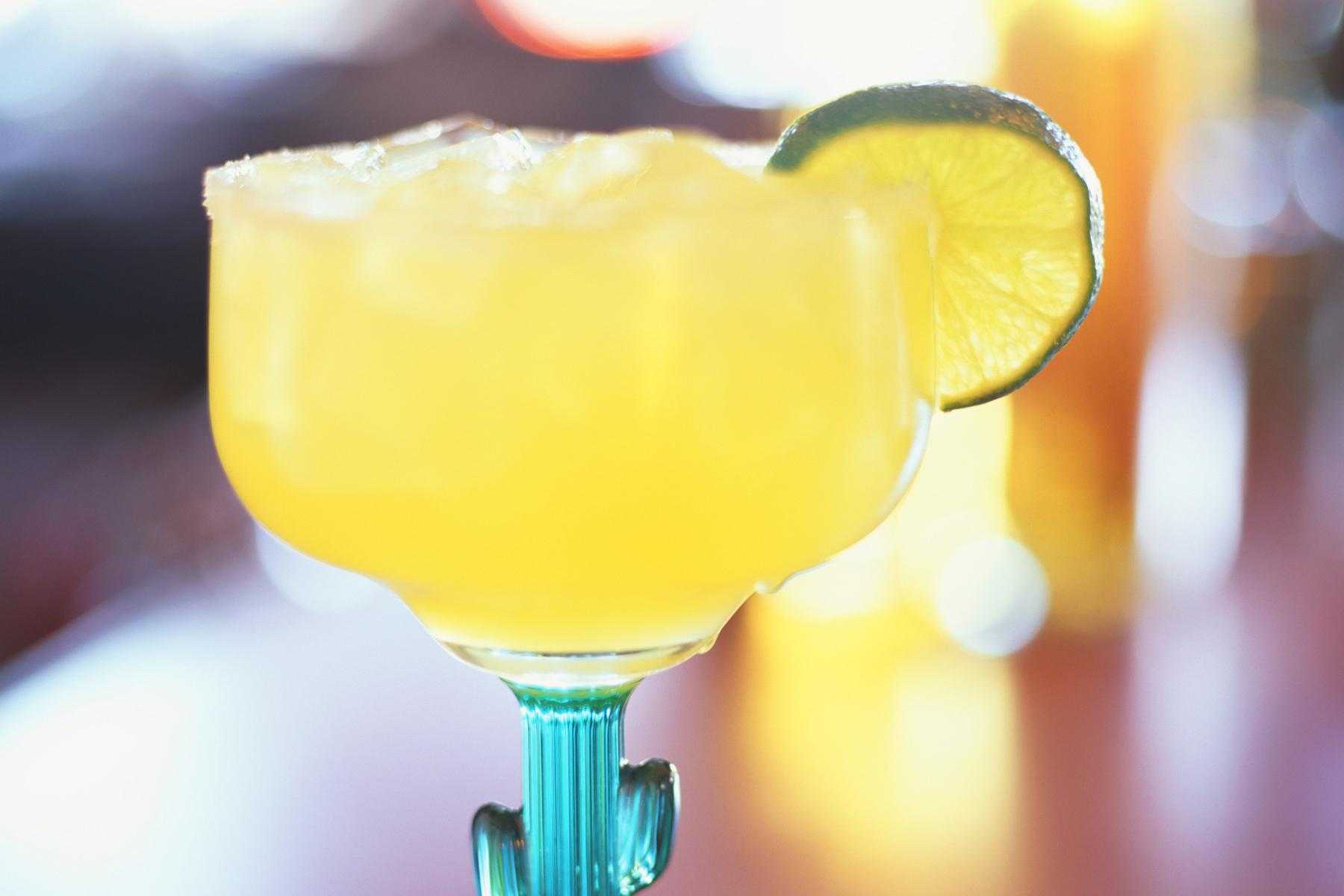 Margarita in glass with a lime wedge.