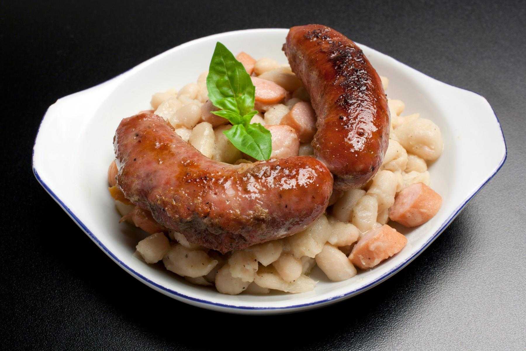 A plate of pasta with rapini and Italian Chicken Sausage.