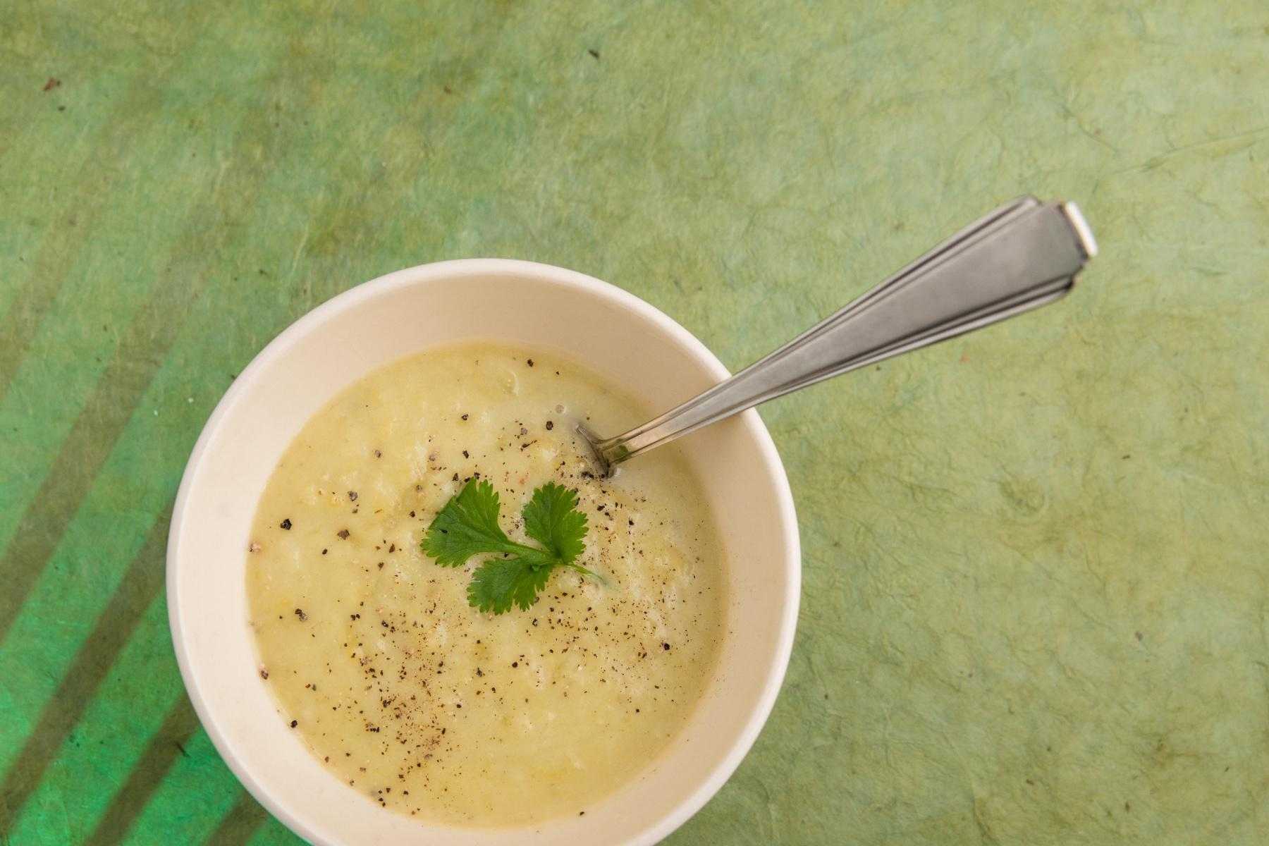 Overhead view of a bowl of celery soup.