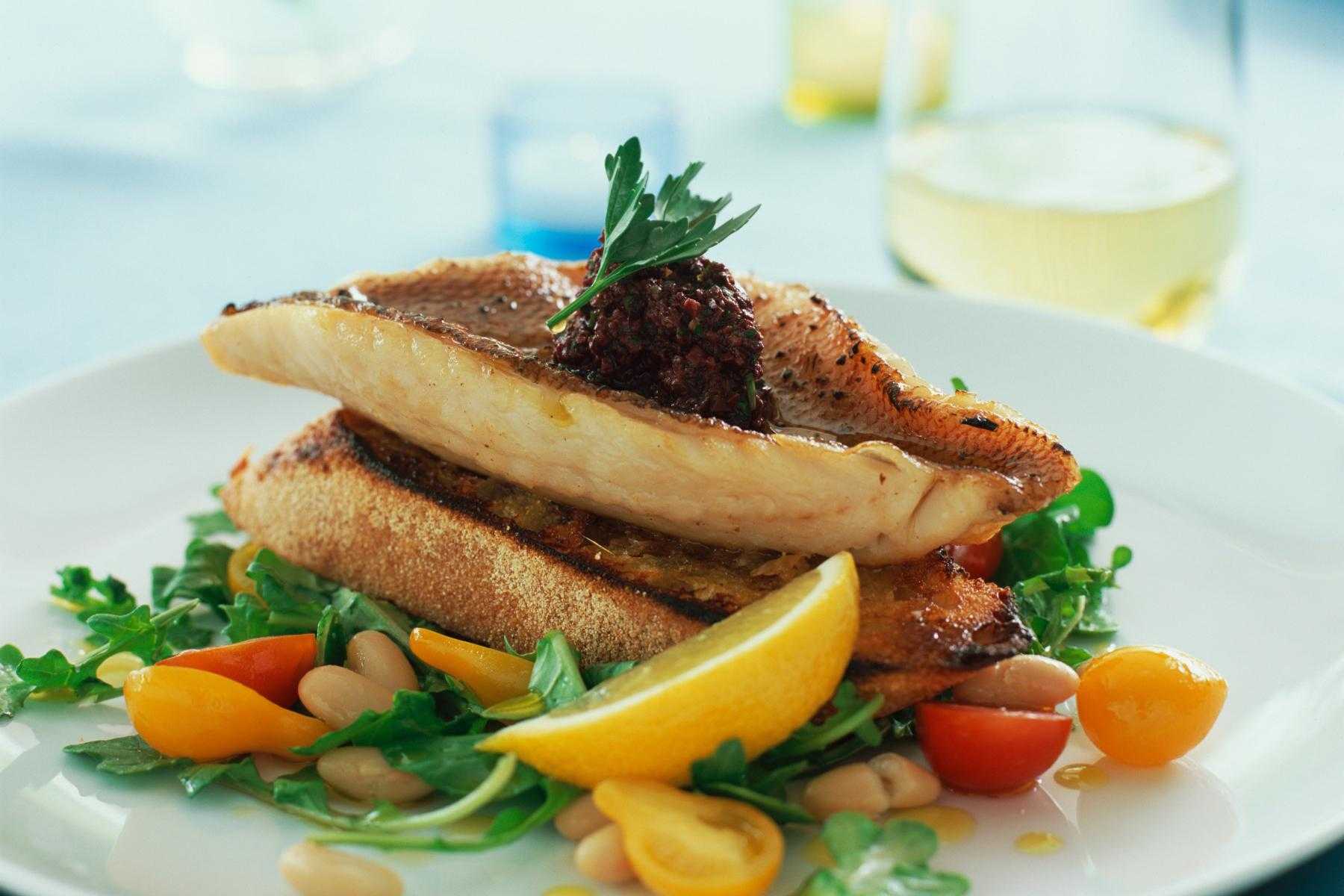 Plate of red snapper with kumquat vinaigrette.