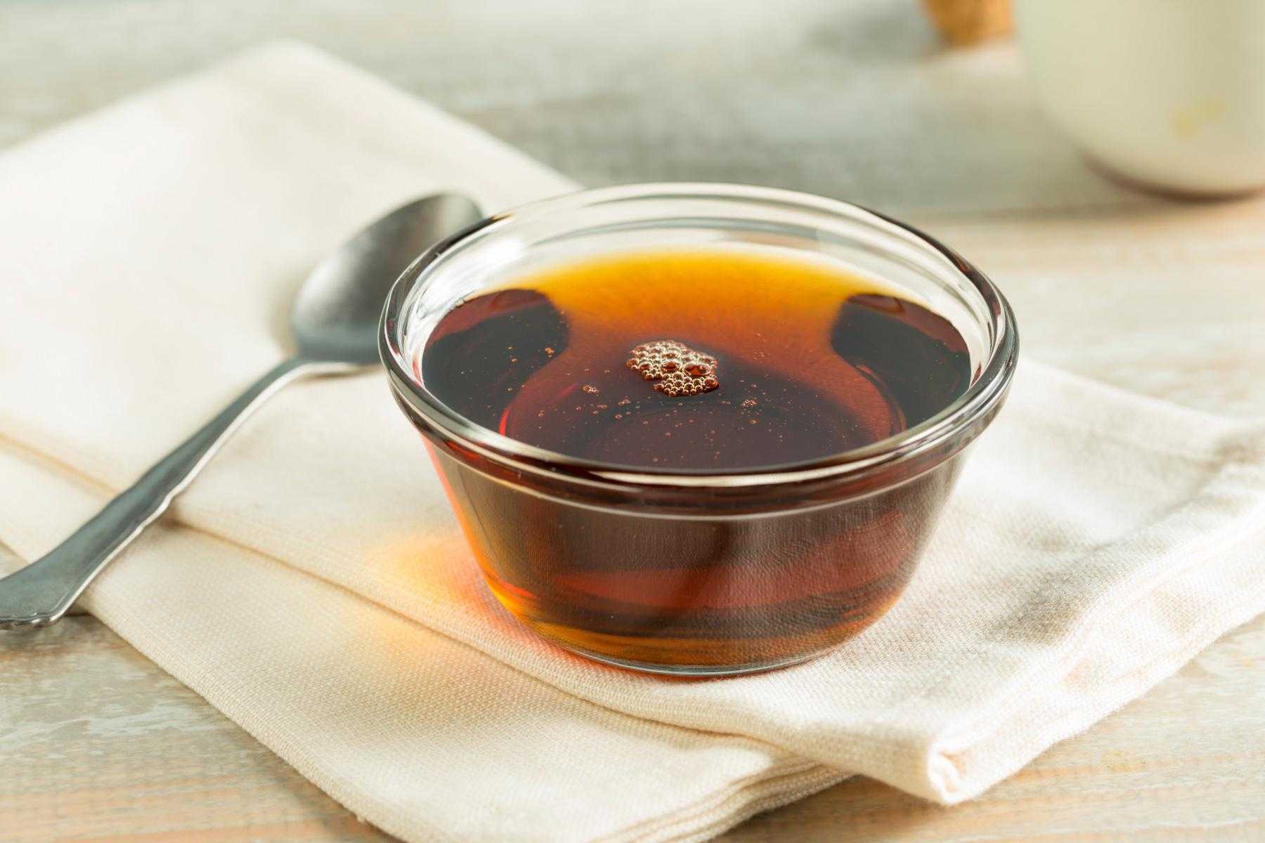 Close-up of a clear bowl of syrup.