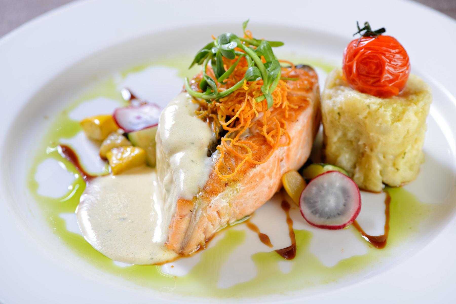 Plate with seared salmon and side salad.