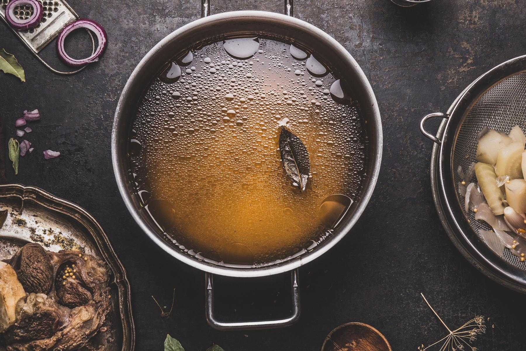 Overhead view of pot of vegetable broth.