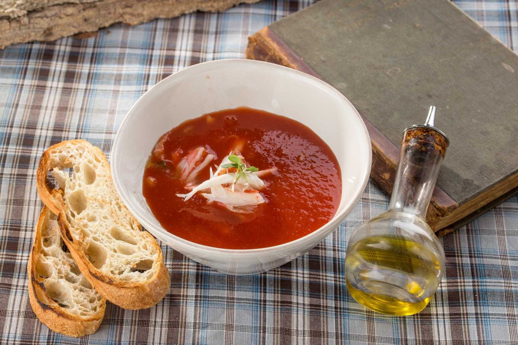 Overhead view of a white bowl filled with gazpacho.