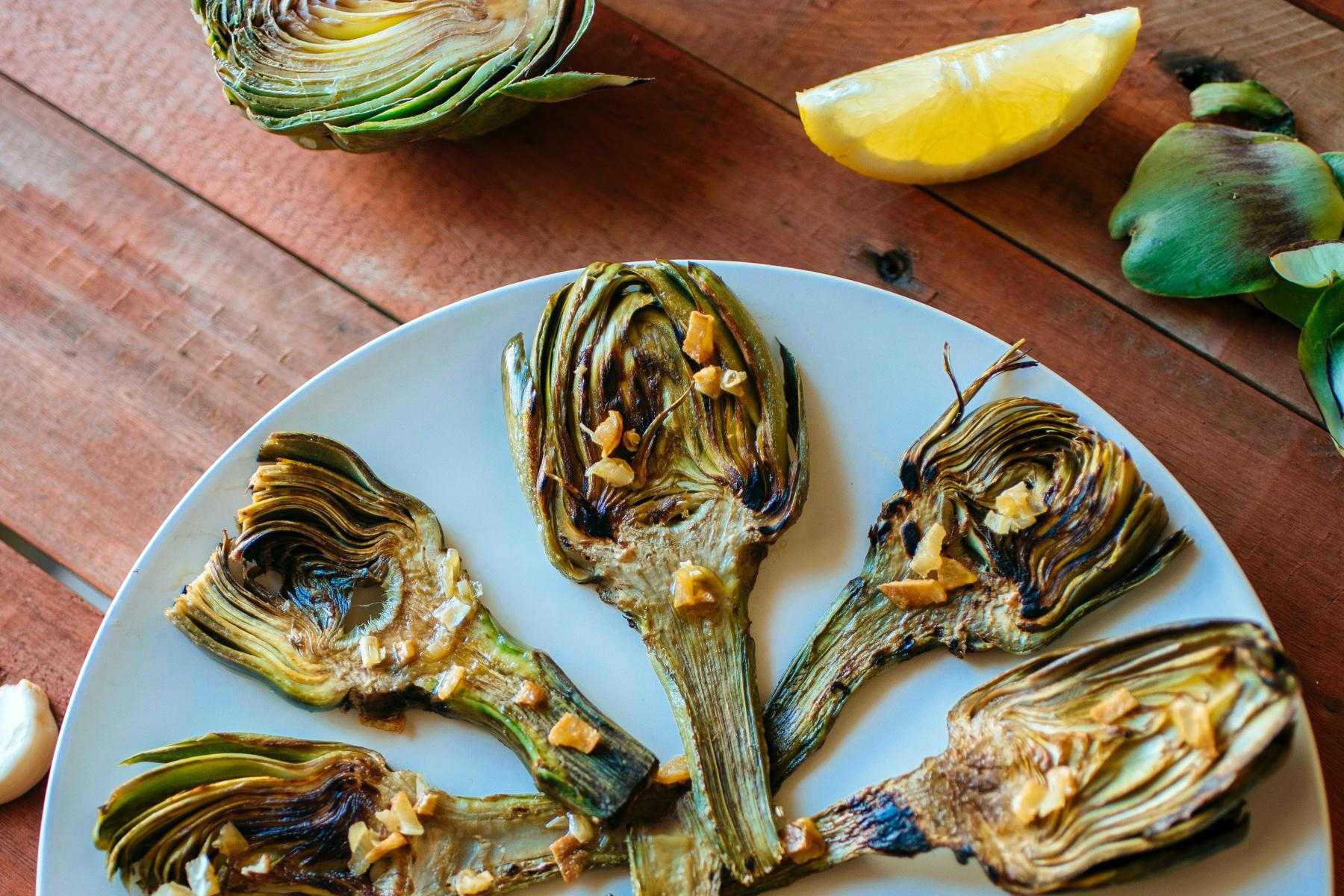 Beautiful plating of grilled artichokes.