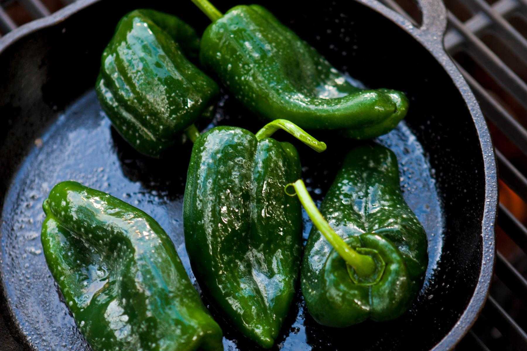 Poblano peppers in pan.