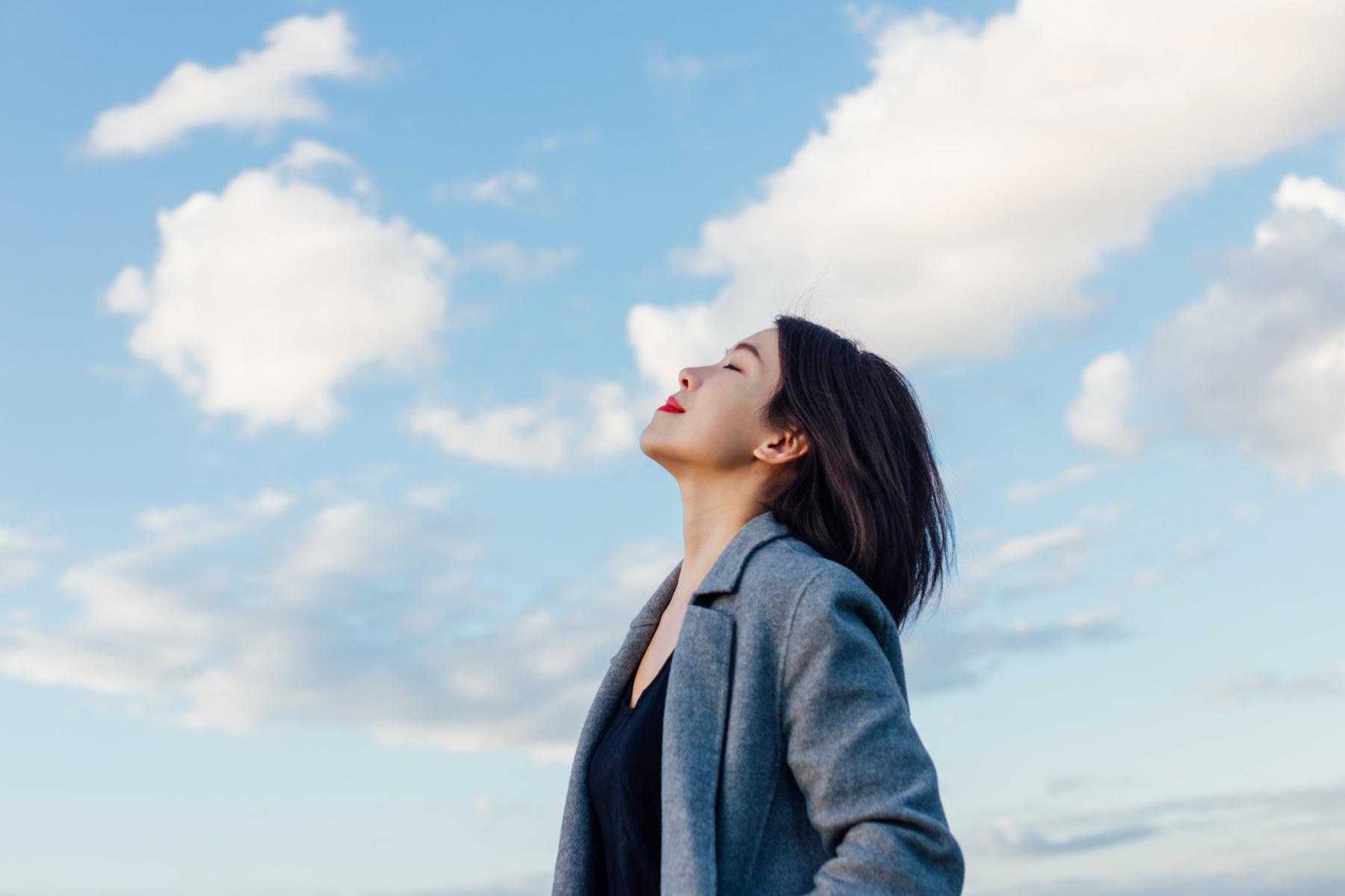 Woman looking up at the sky.