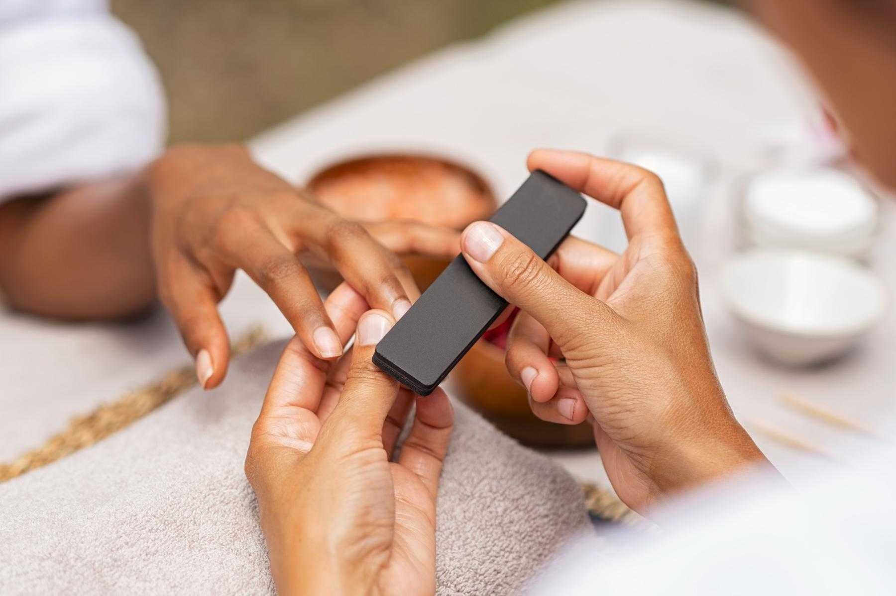 A woman getting a manicure.
